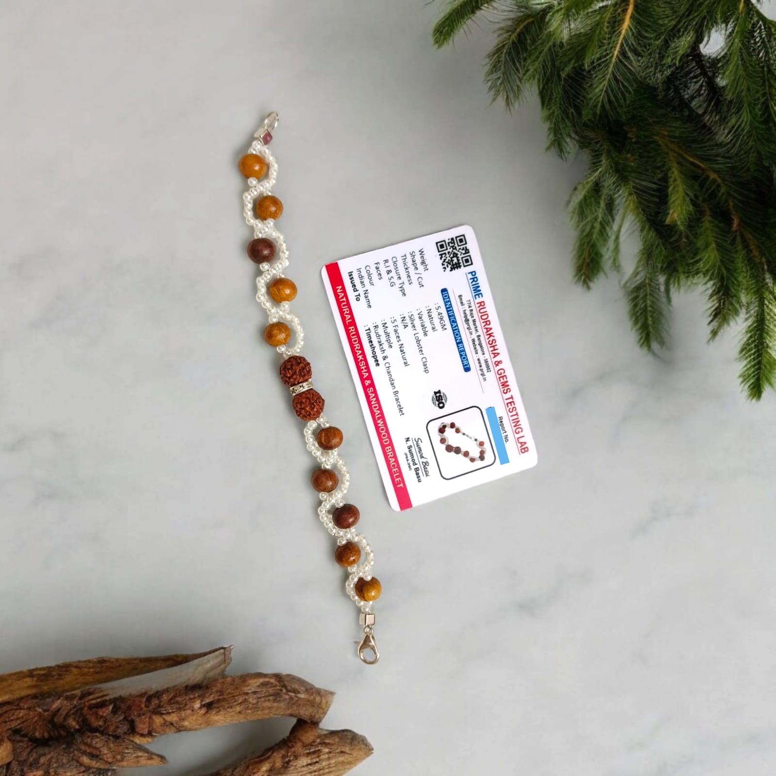 Lab-certified Rudraksha and Sandalwood Bracelet with 8MM beads, featuring white pearl accents and a silver lobster clasp, designed for meditation, strength, and spiritual growth by Timeshopee.