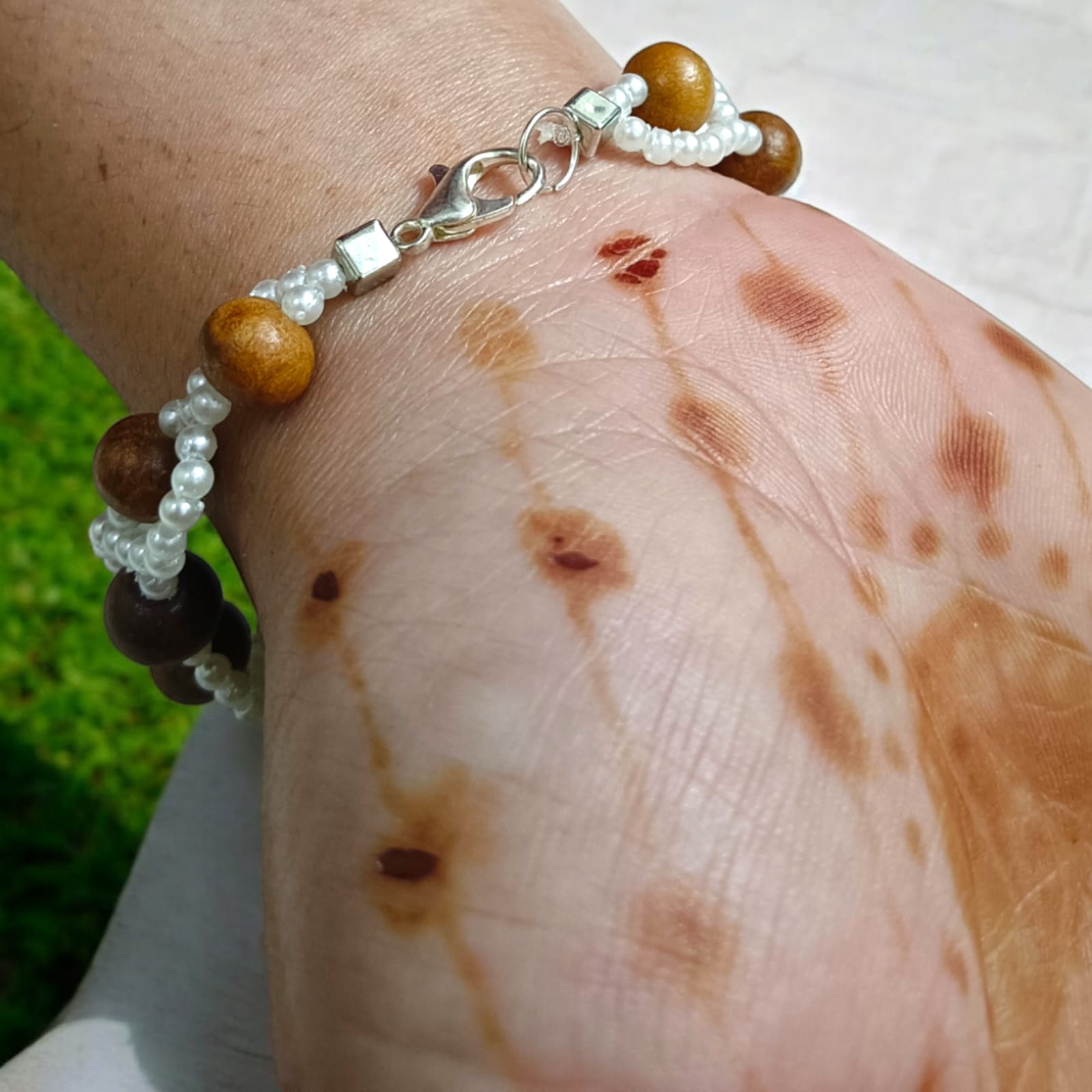 Lab-certified Rudraksha and Sandalwood Bracelet with 8MM beads, featuring white pearl accents and a silver lobster clasp, designed for meditation, strength, and spiritual growth by Timeshopee.