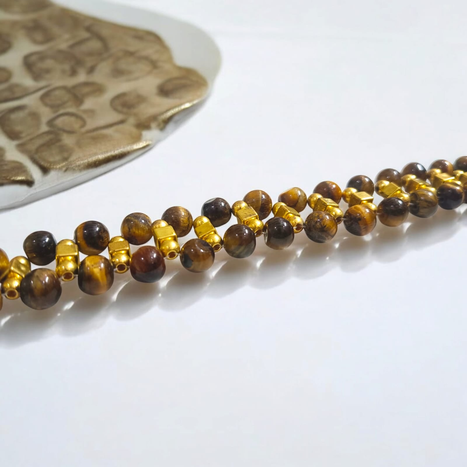 Lab-certified Tiger Eye Bracelet with 7MM beads, featuring golden metal accents and a golden lobster clasp, designed for strength, confidence, and business growth by Timeshopee.