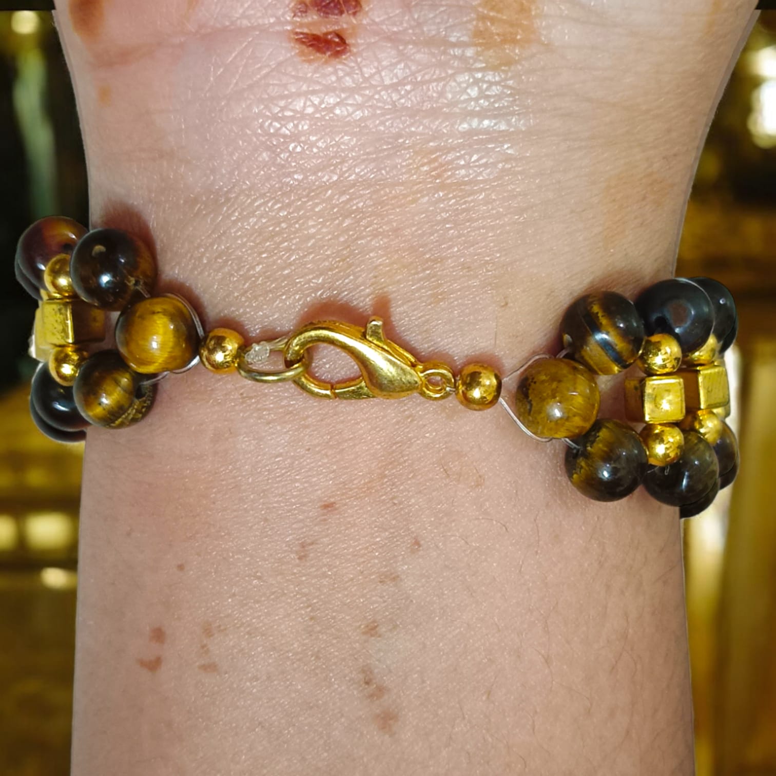 Lab-certified Tiger Eye Bracelet with 7MM beads, featuring golden metal accents and a golden lobster clasp, designed for strength, confidence, and business growth by Timeshopee.