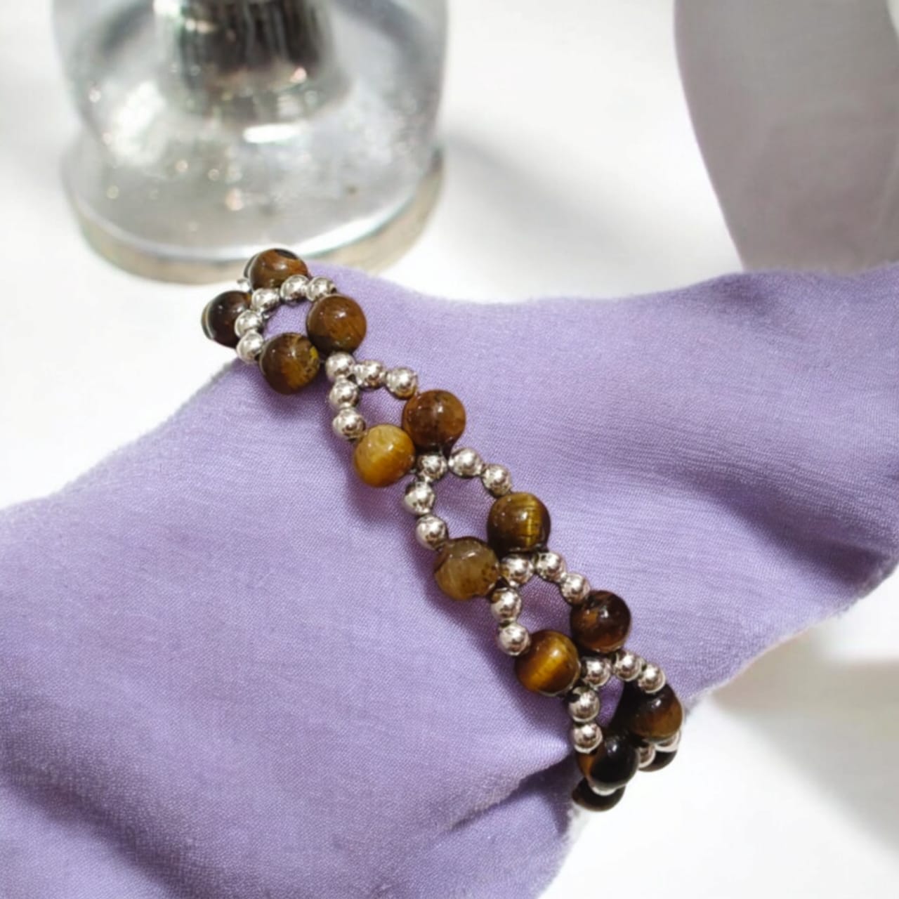 Lab Certified Genuine Tiger Eye Bracelet with 7MM beads, silver bead accents, adjustable lobster clasp, stylish design for confidence and strength.