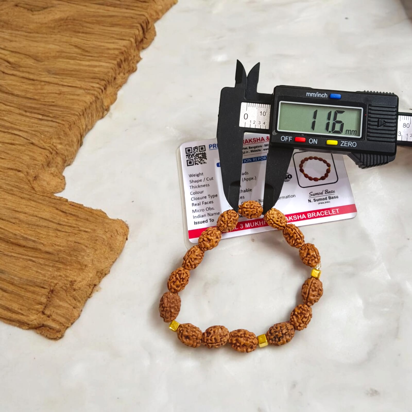 Lab certified 3 Mukhi Rudraksha bracelet with 12mm beads, offering Trishakti protection, perfect for spiritual wear and gifting.