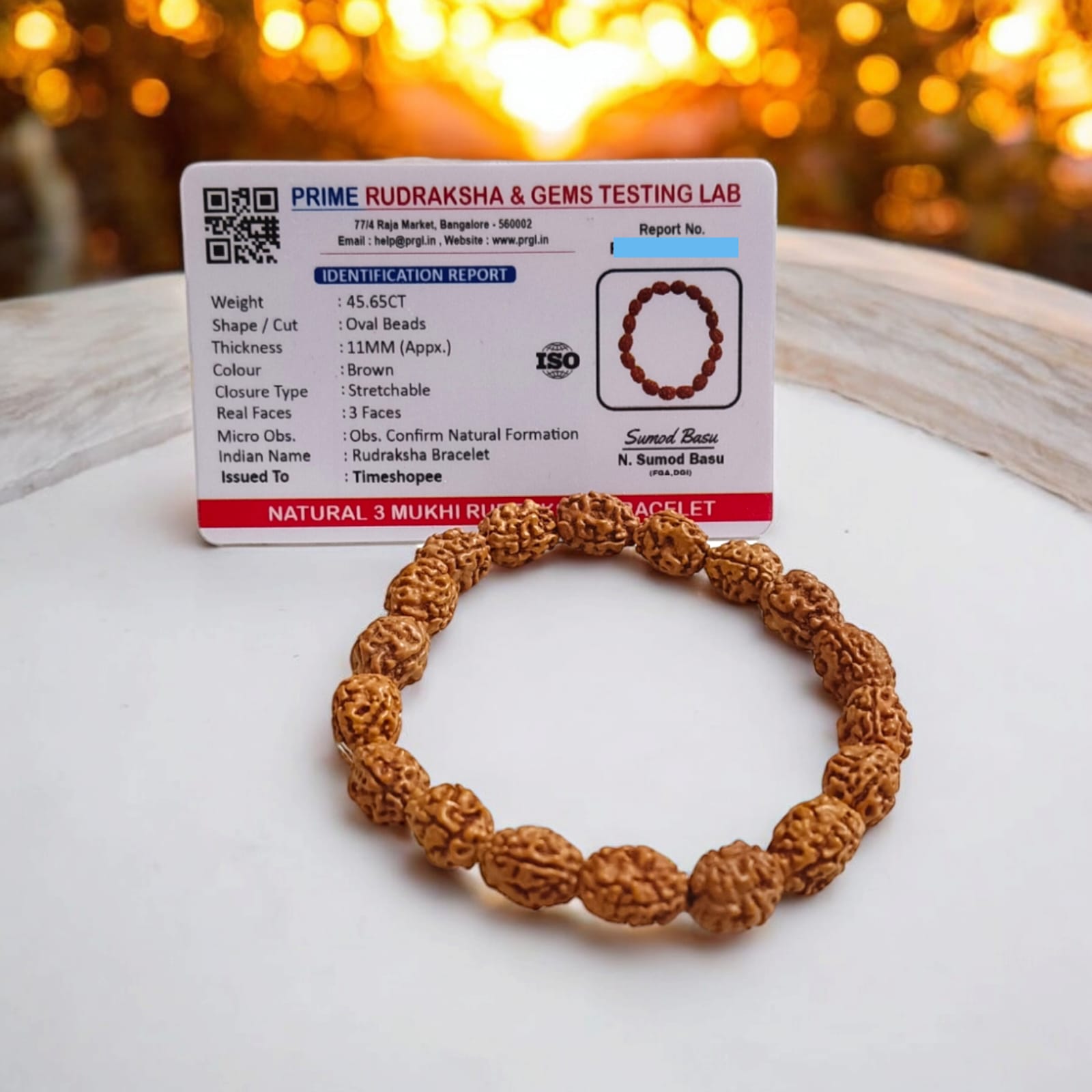 Lab certified 3 Mukhi Rudraksha bracelet with 12mm beads, offering Trishakti protection, perfect for spiritual wear and gifting.