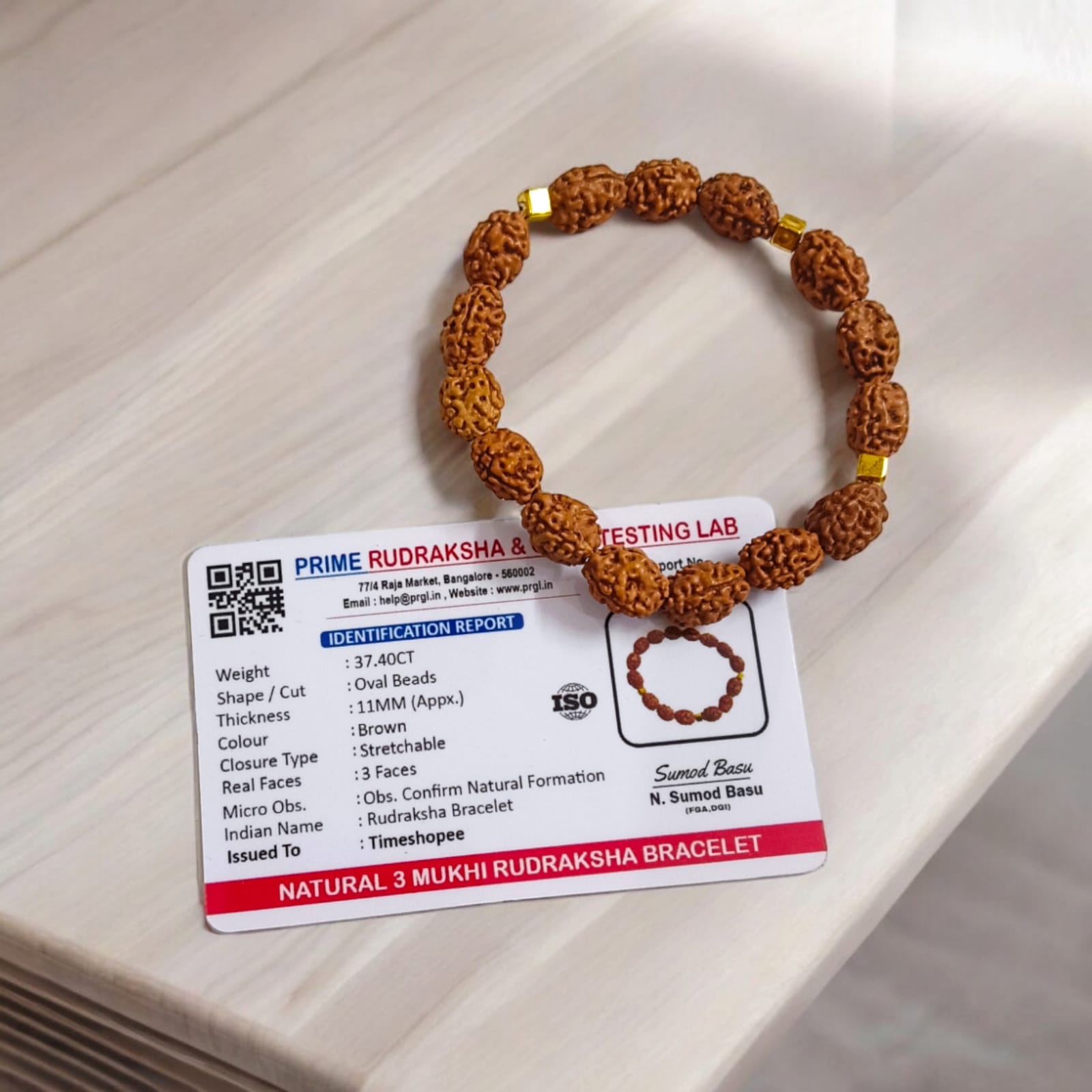Lab certified 3 Mukhi Rudraksha bracelet with 12mm beads, offering Trishakti protection, perfect for spiritual wear and gifting.
