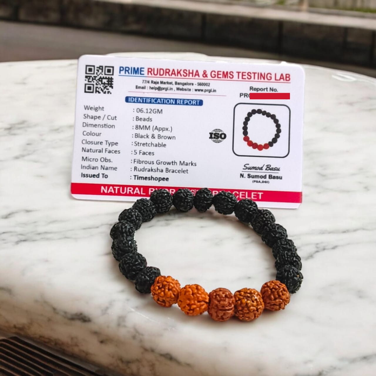 Lab certified 5 Mukhi Rudraksha bracelet in a black and brown mix with 6-8 mm beads, featuring a stretchable design for comfortable wear.