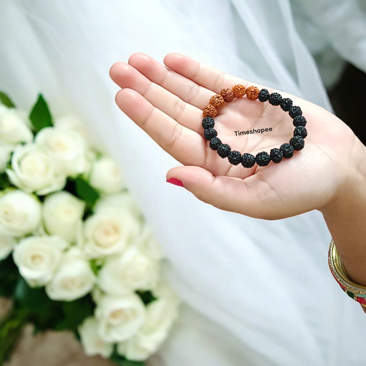 Lab certified 5 Mukhi Rudraksha bracelet in a black and brown mix with 6-8 mm beads, featuring a stretchable design for comfortable wear.