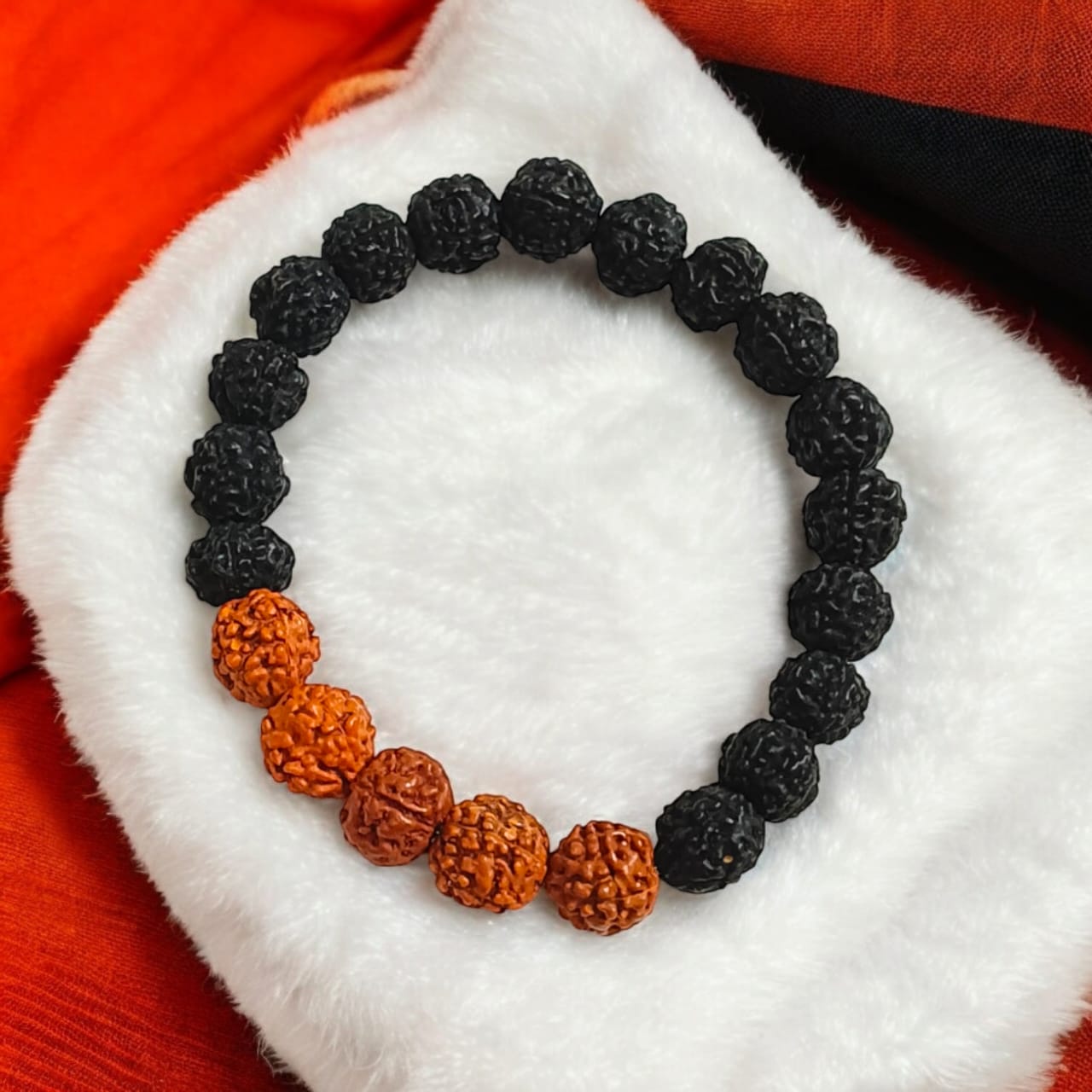 Lab certified 5 Mukhi Rudraksha bracelet in a black and brown mix with 6-8 mm beads, featuring a stretchable design for comfortable wear.