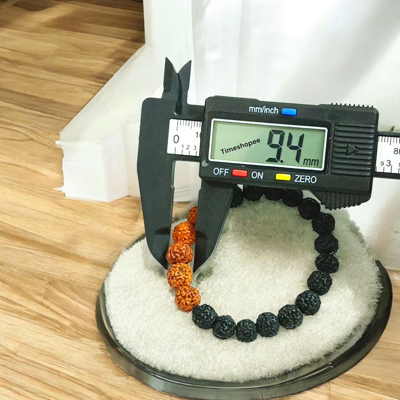 Lab certified 5 Mukhi Rudraksha bracelet in a black and brown mix with 6-8 mm beads, featuring a stretchable design for comfortable wear.