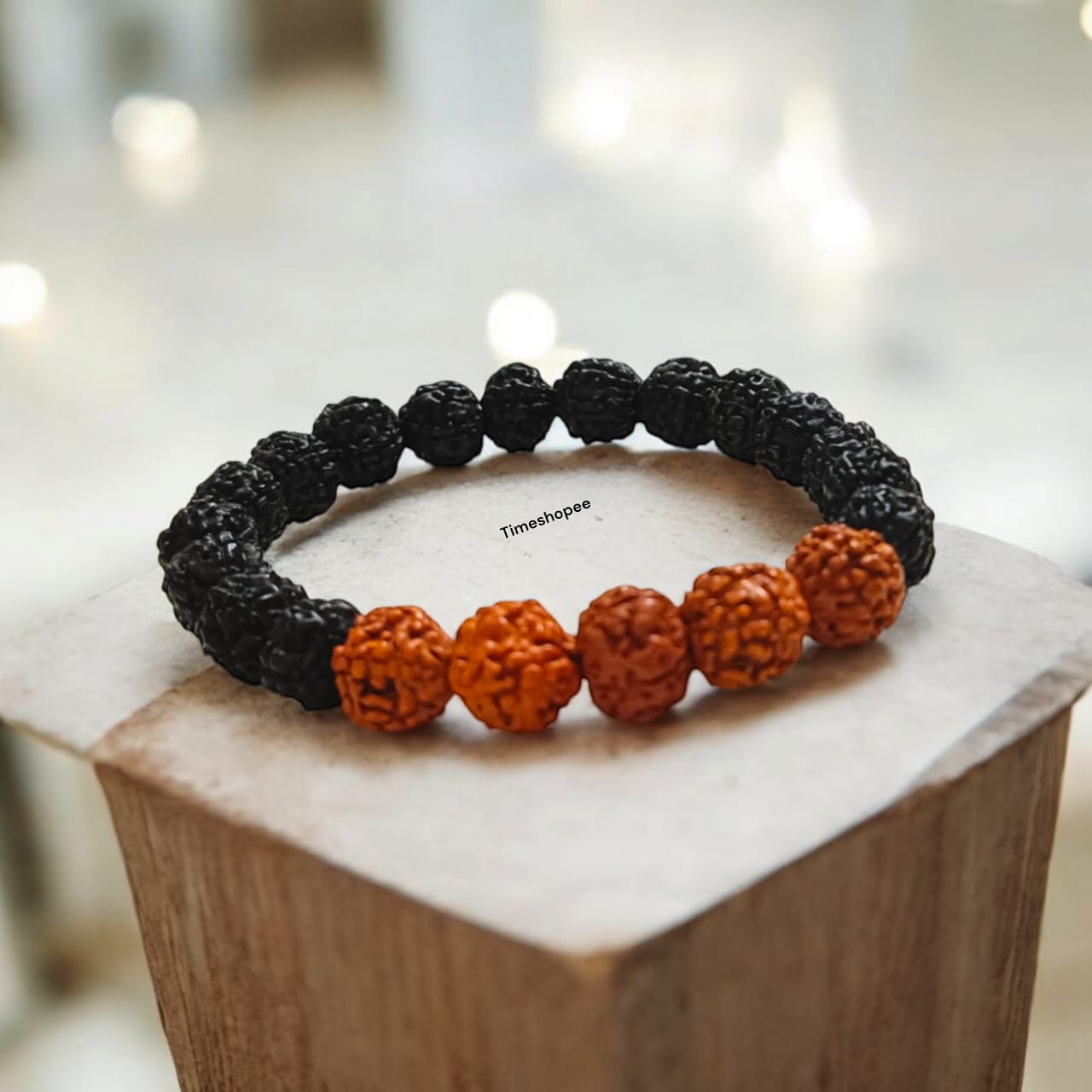 Lab certified 5 Mukhi Rudraksha bracelet in a black and brown mix with 6-8 mm beads, featuring a stretchable design for comfortable wear.