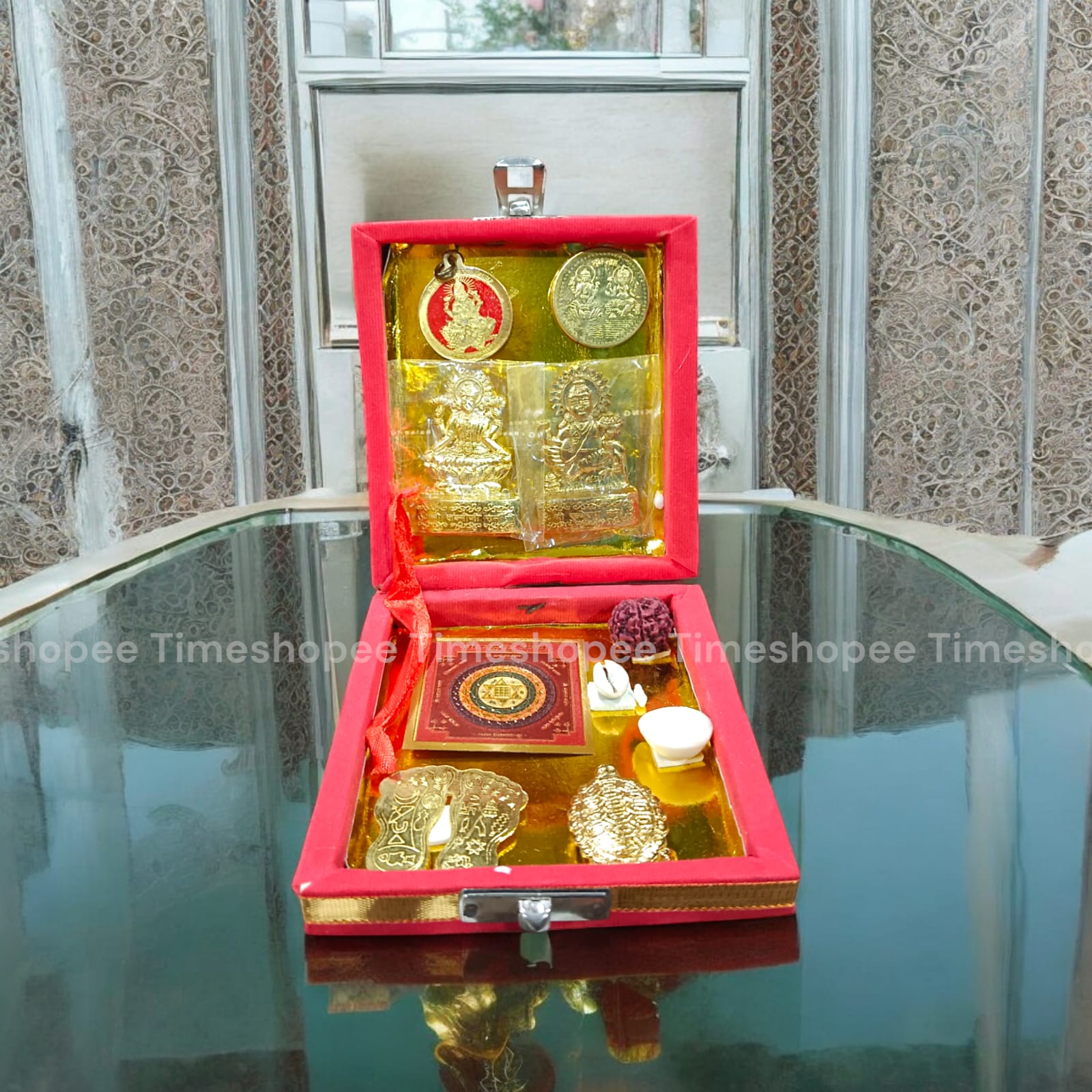 Lakshmi Kuber Box with various pooja items including idols, coins, yantra, and more, organized in a designed wooden box from Timeshopee