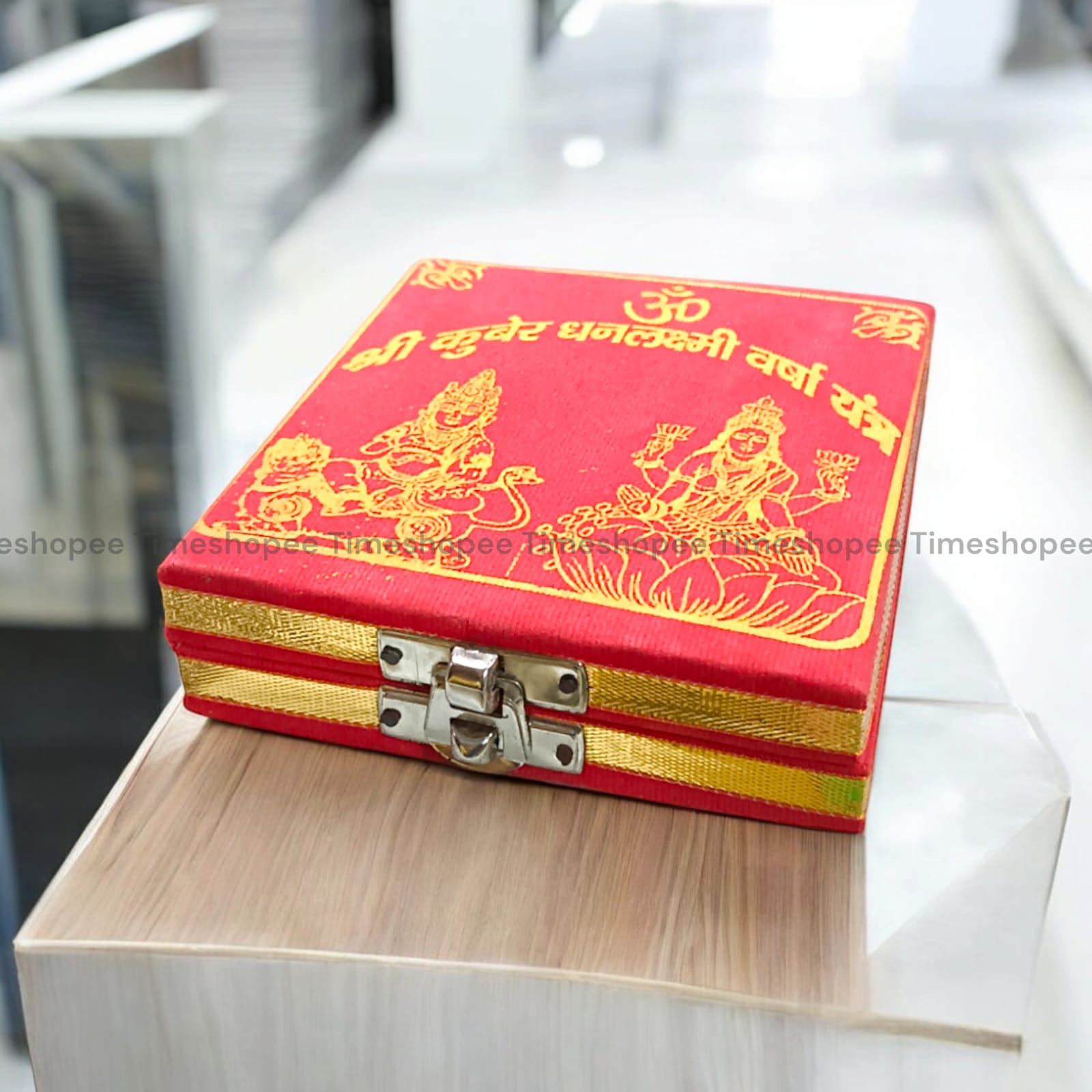 Lakshmi Kuber Box with various pooja items including idols, coins, yantra, and more, organized in a designed wooden box from Timeshopee