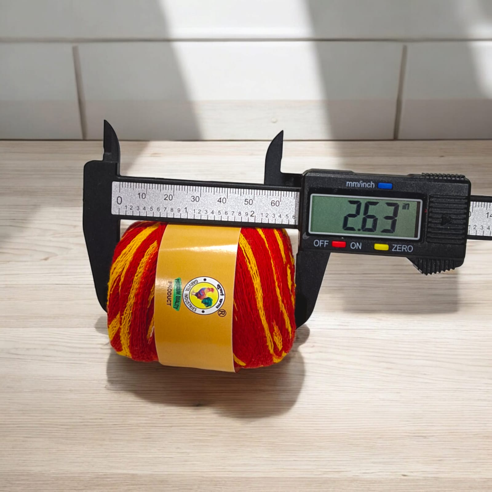 Large bundle of red moli kalawa, used in religious ceremonies for blessings and protection.