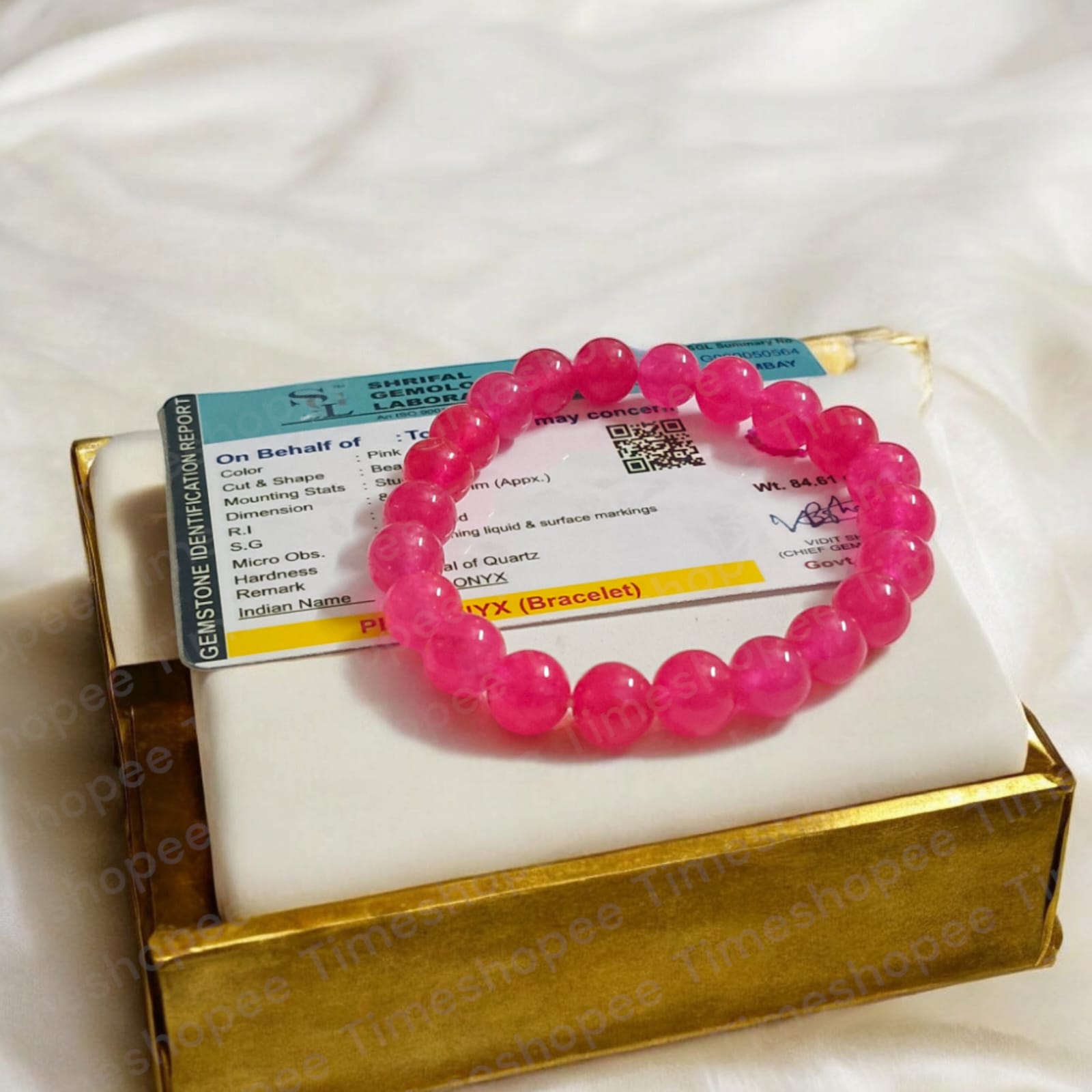 Light Pink ONYX Bracelet with lab certificate showing a close-up view of the elegant stretchable design.