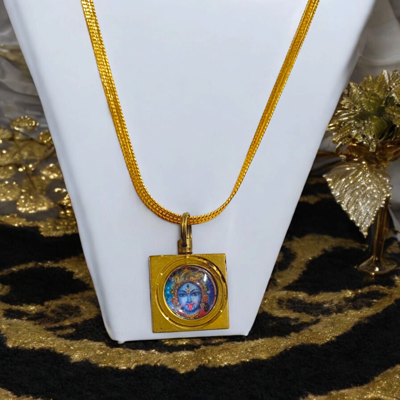 Maa Kali Vashikaran Locket with golden chain, featuring Vashikaran Yantra, available at Timeshopee