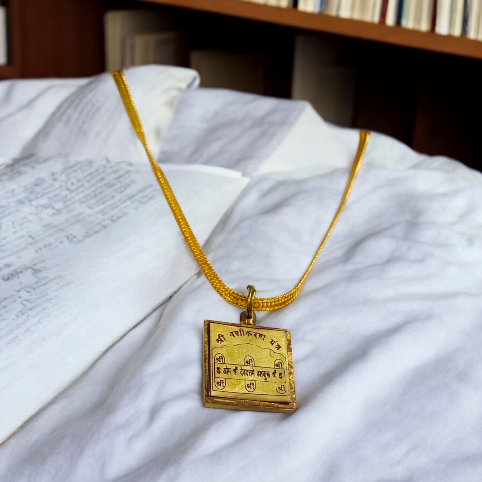 Maa Kali Vashikaran Locket with golden chain, featuring Vashikaran Yantra, available at Timeshopee