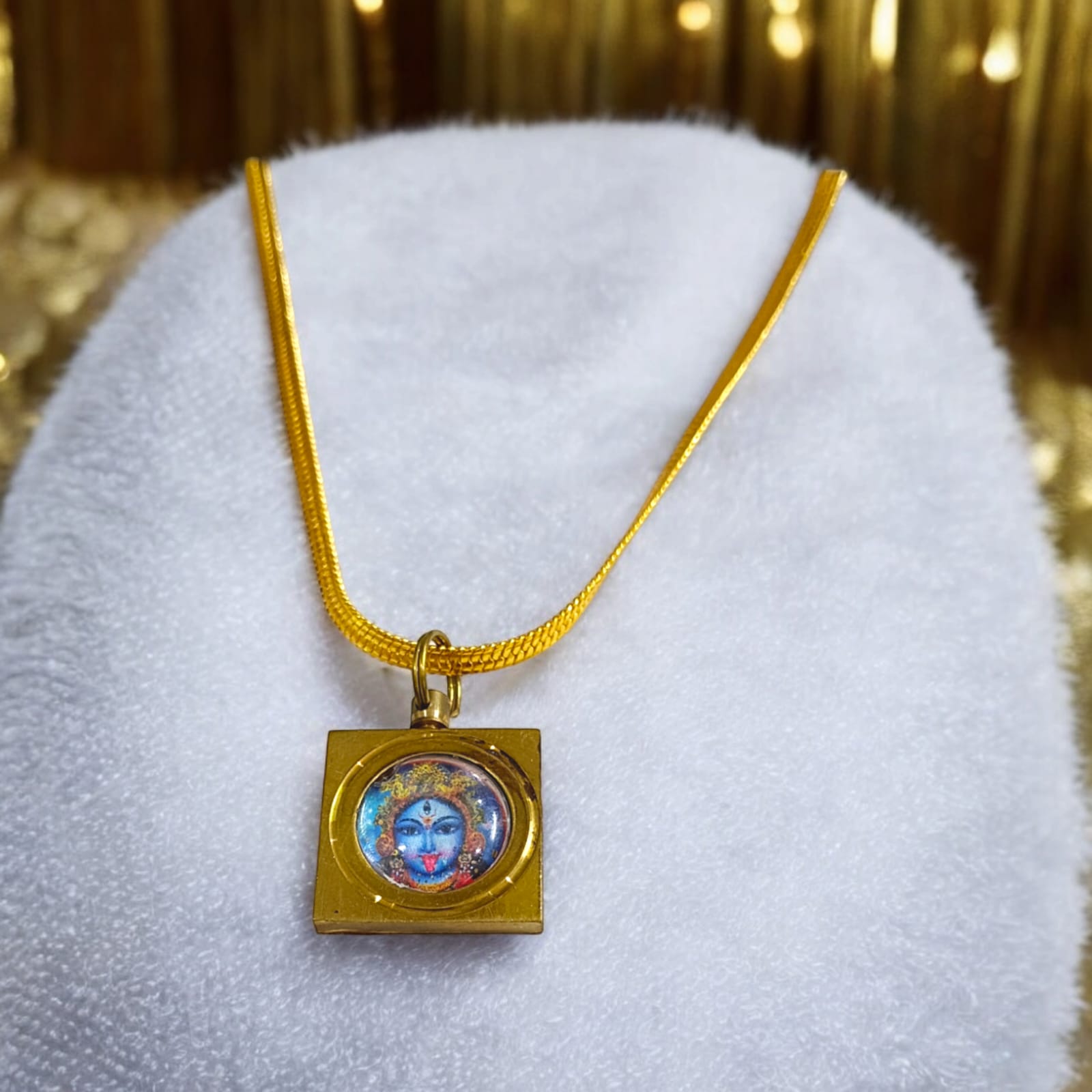 Maa Kali Vashikaran Locket with golden chain, featuring Vashikaran Yantra, available at Timeshopee