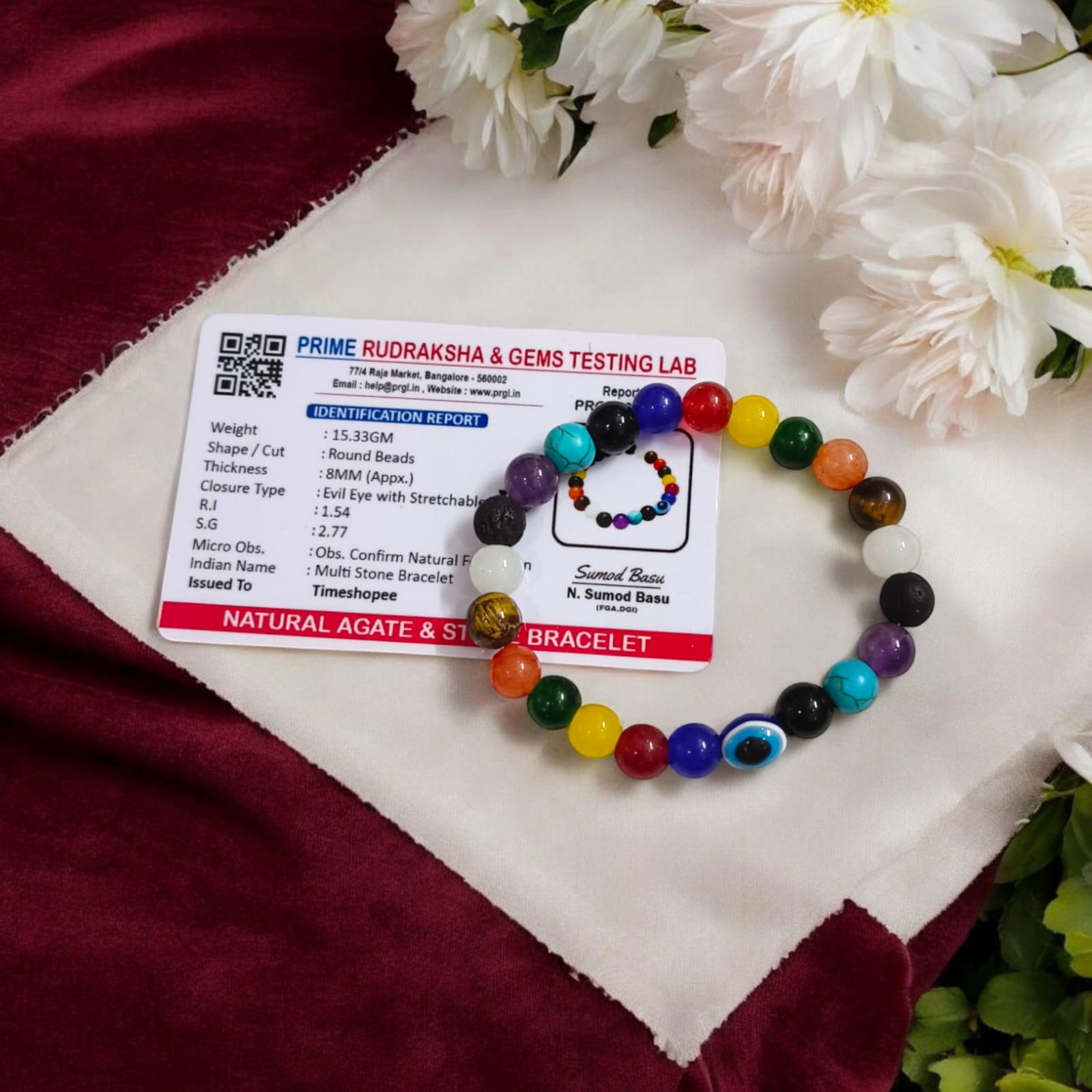 Mix Agate and 7 Chakra bracelet featuring colorful 8MM beads, including Agates, Lava, Amethyst, Tiger Eye, Turquoise, Hessonite, and an Evil Eye bead, offering balance and protection.
