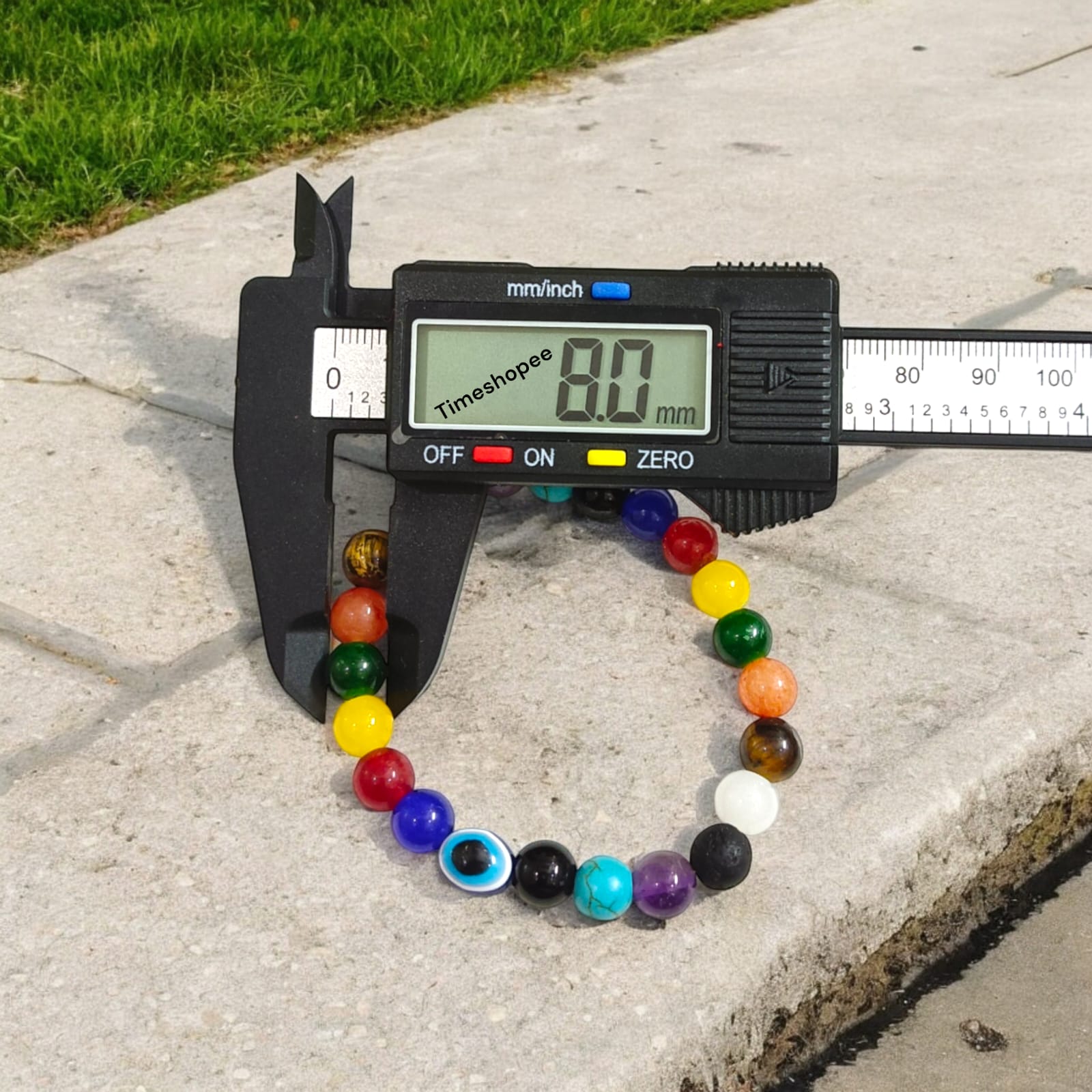 Mix Agate and 7 Chakra bracelet featuring colorful 8MM beads, including Agates, Lava, Amethyst, Tiger Eye, Turquoise, Hessonite, and an Evil Eye bead, offering balance and protection.