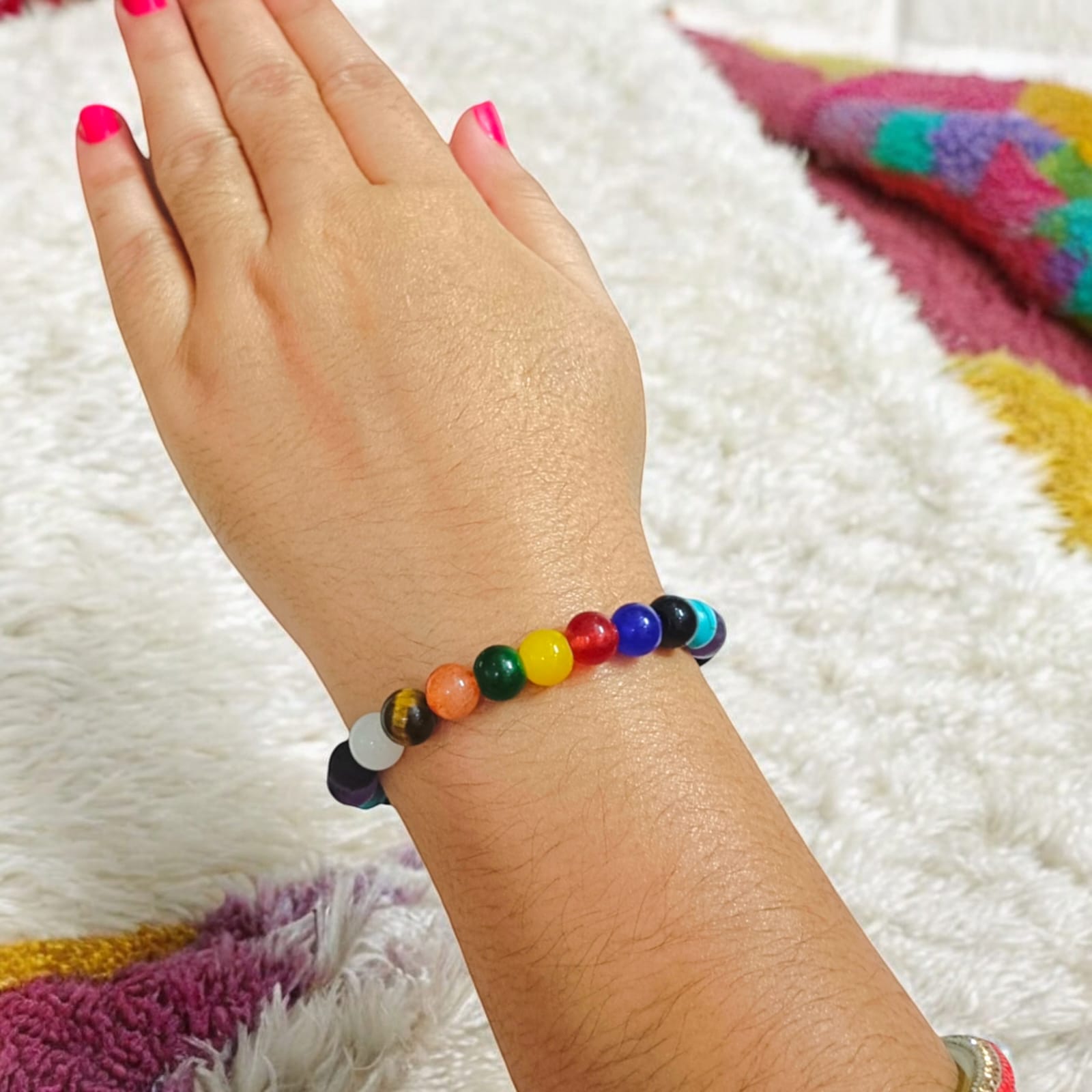 Mix Agate and 7 Chakra bracelet featuring colorful 8MM beads, including Agates, Lava, Amethyst, Tiger Eye, Turquoise, Hessonite, and an Evil Eye bead, offering balance and protection.