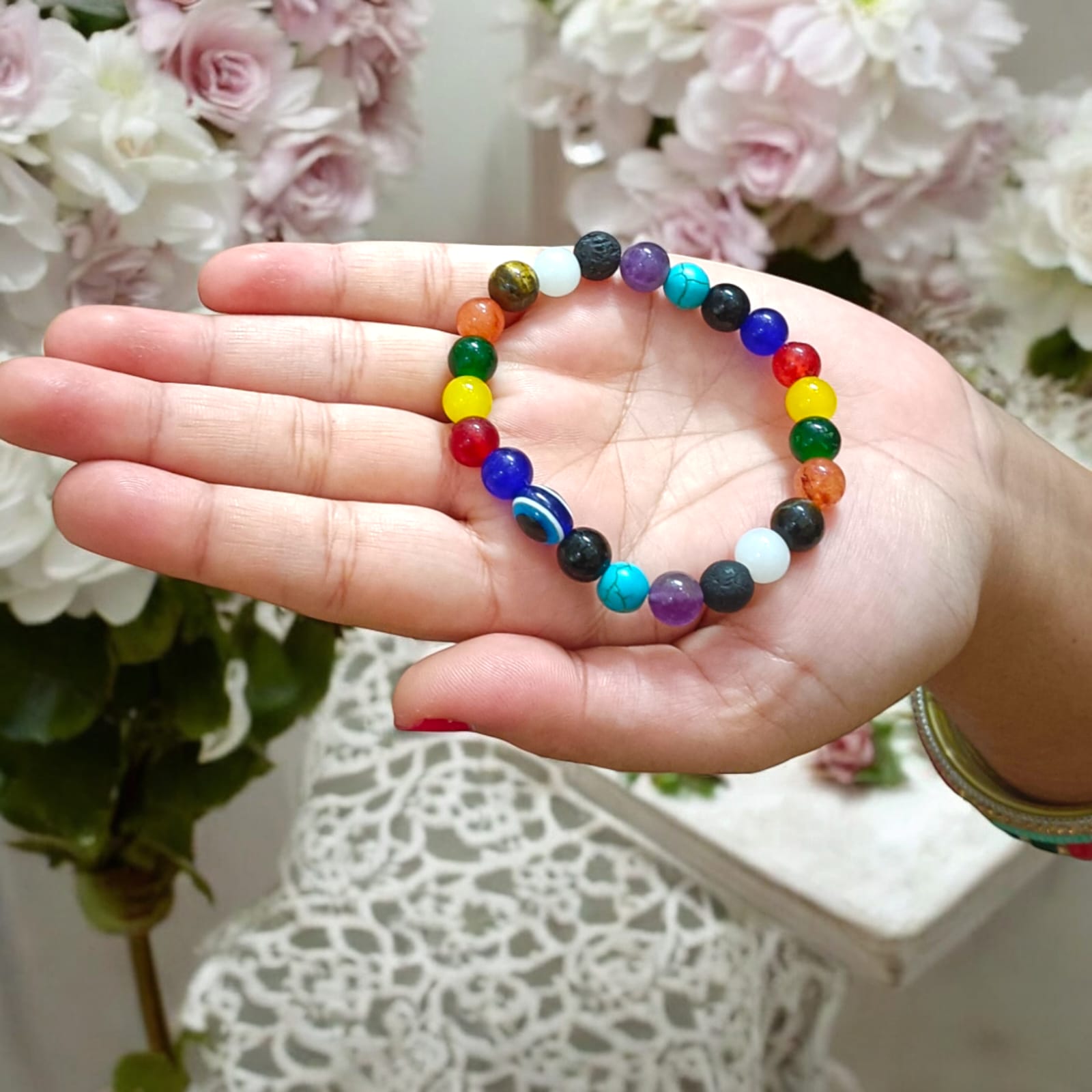 Mix Agate and 7 Chakra bracelet featuring colorful 8MM beads, including Agates, Lava, Amethyst, Tiger Eye, Turquoise, Hessonite, and an Evil Eye bead, offering balance and protection.