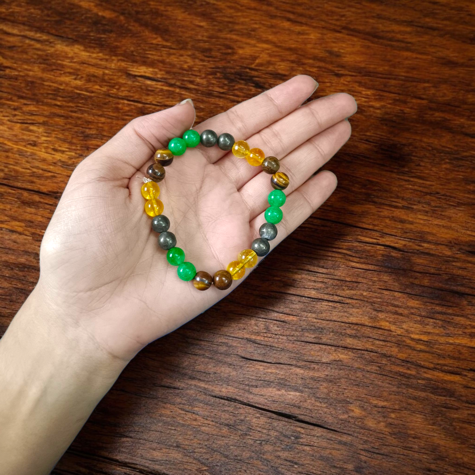 Money Magnet Bracelet made of 8mm lab-certified magnetic beads with stretchable design, used for attracting wealth, luck, and financial success