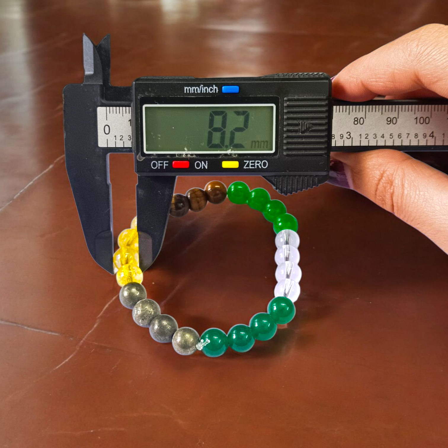 Money Magnet Bracelet with 8mm lab-certified magnetic beads and stretchable design, ideal for attracting wealth, opportunities, and financial growth