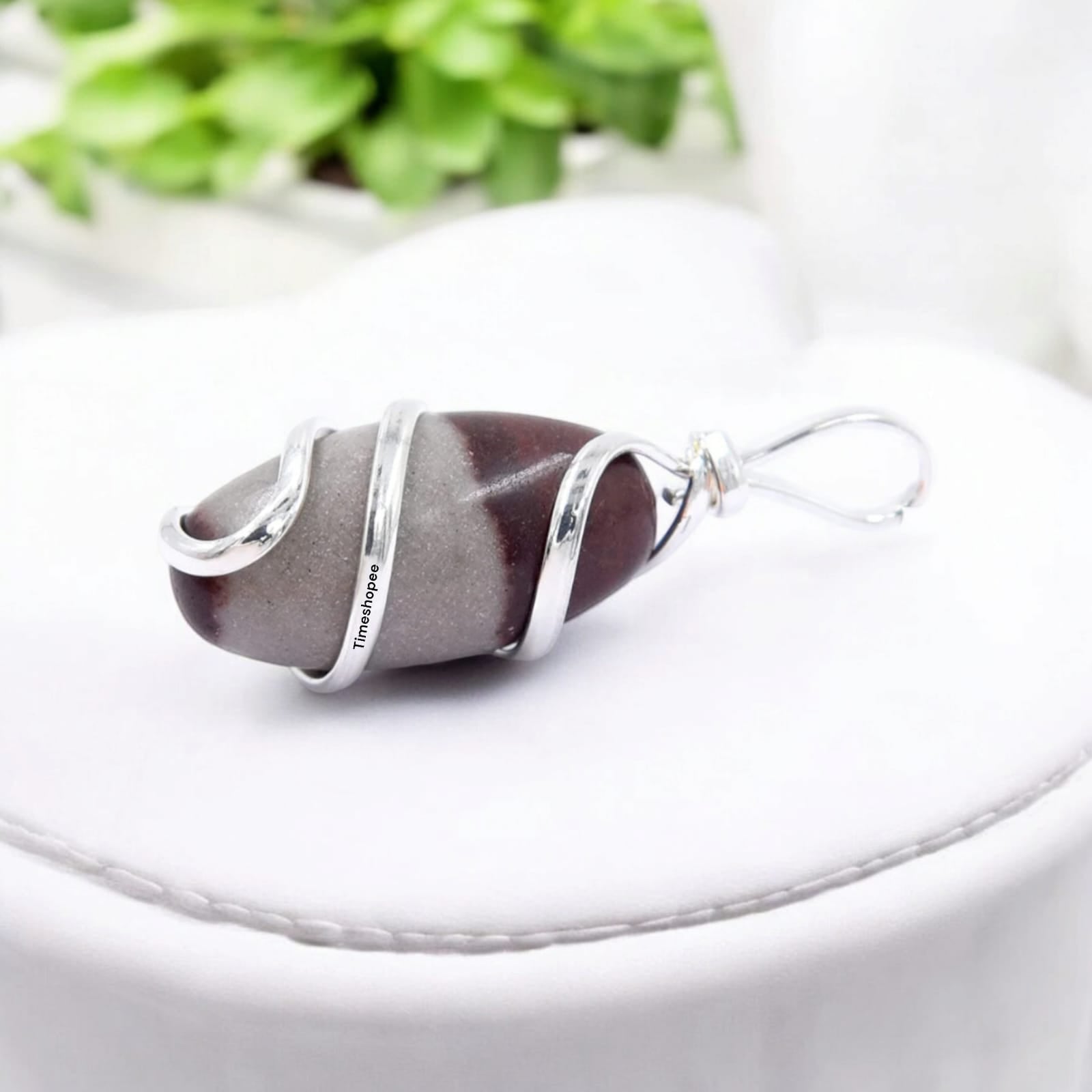 Narmadeshwar Shivling Pendant with red knotted thread, lab certified, made from Narmada river stone.