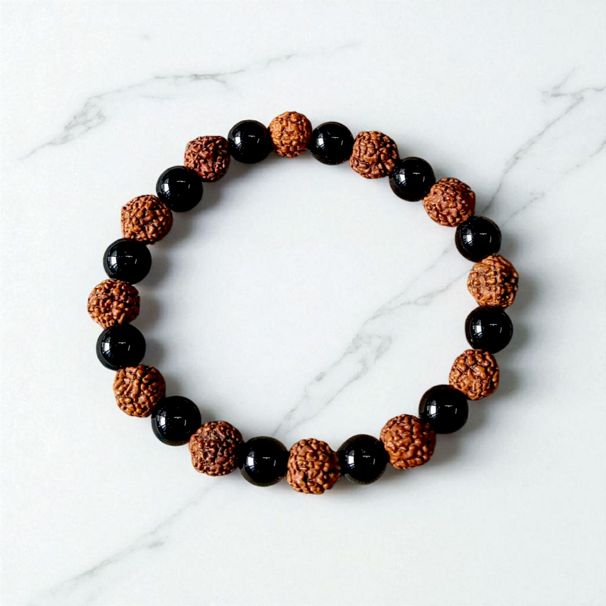 Natural Agate and 5 Mukhi Rudraksha bracelet with black and brown beads on a white background