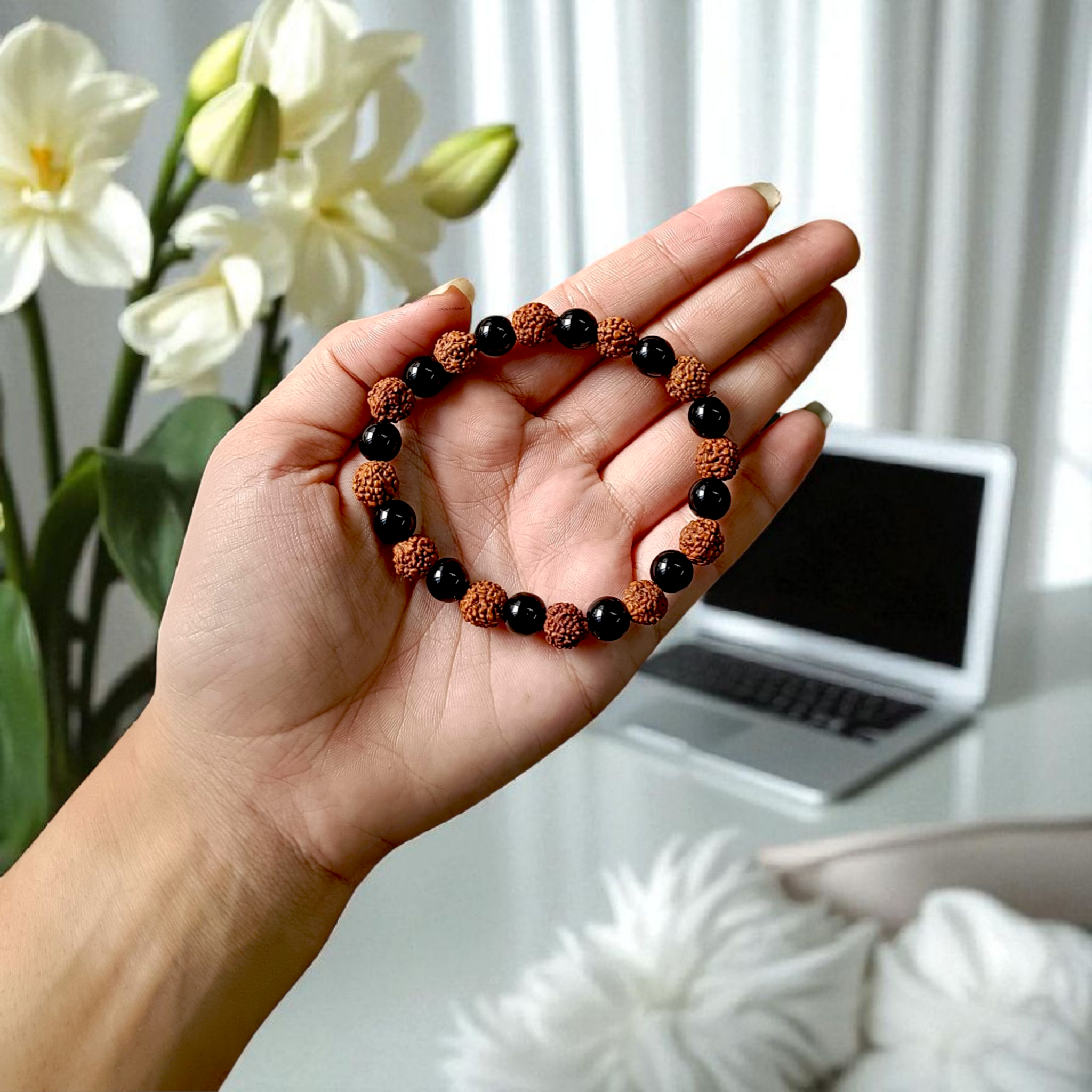 Natural Agate and 5 Mukhi Rudraksha bracelet with black and brown beads on a white background