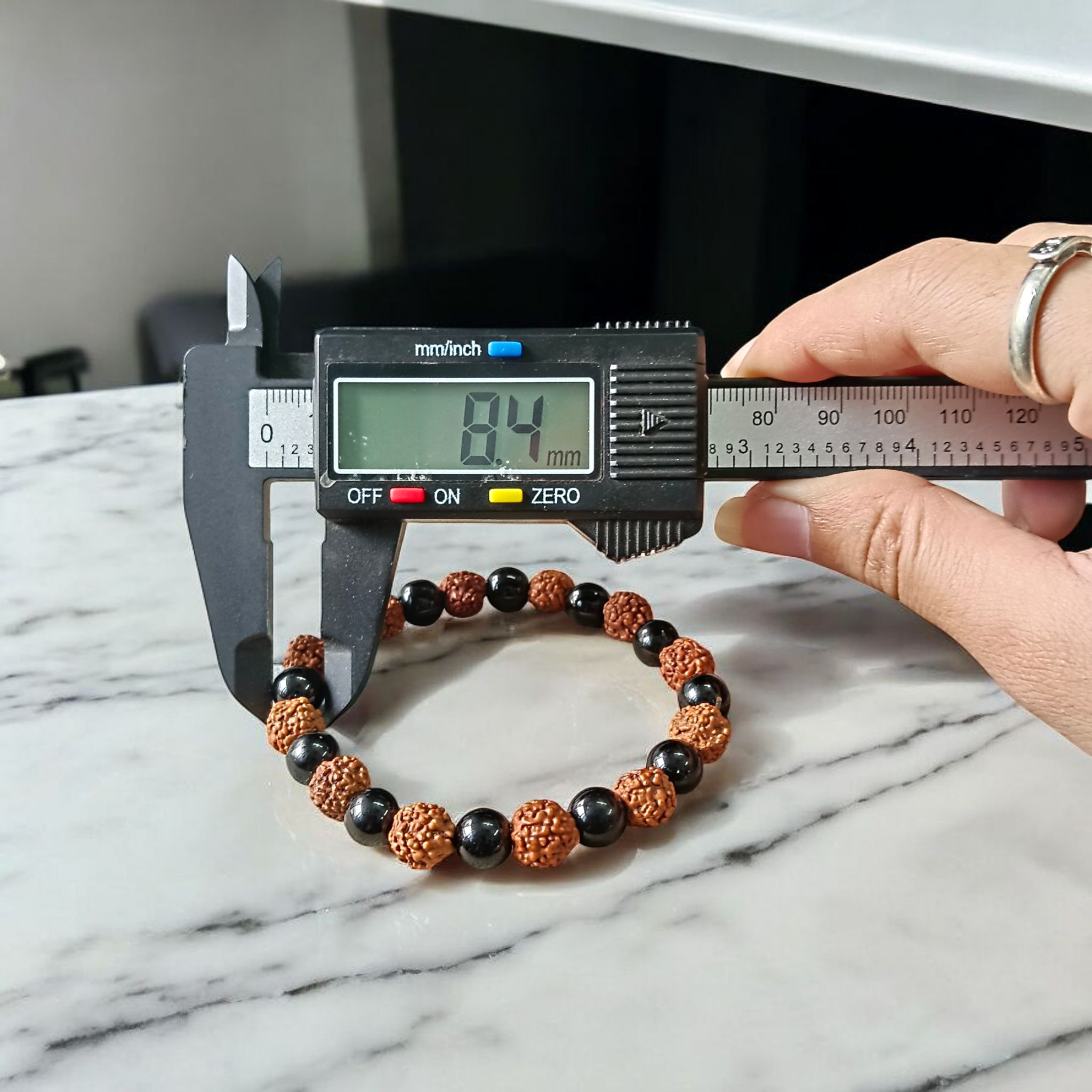 Natural Agate and 5 Mukhi Rudraksha bracelet with black and brown beads on a white background