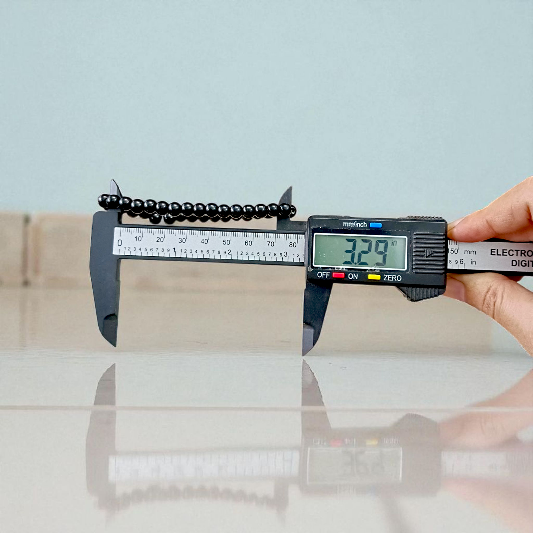 Natural Black Agate Bracelet with 6mm beads, stretchable, displayed on a neutral background