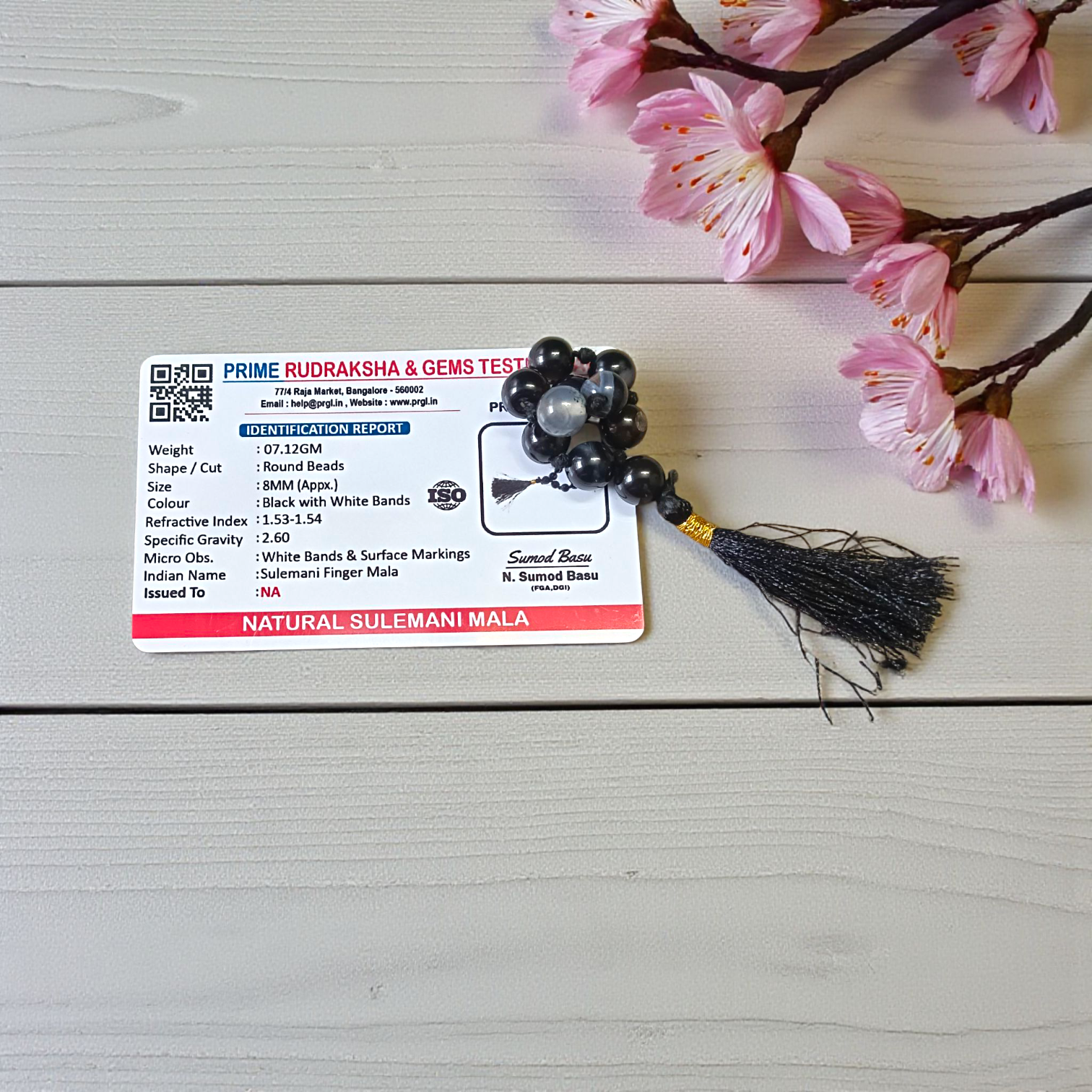 Natural Black Sulemani Finger Mala with 9+1 round 8mm beads displayed on a soft background, ideal for meditation, mantra chanting, and prayer