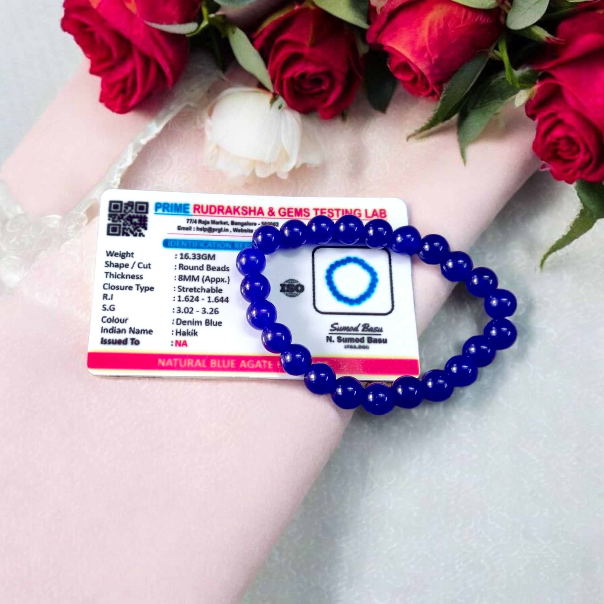 Natural Blue Agate (Hakik) Bracelet with 8mm round beads on a stretchable elastic cord, displayed in hand for spiritual and daily wear