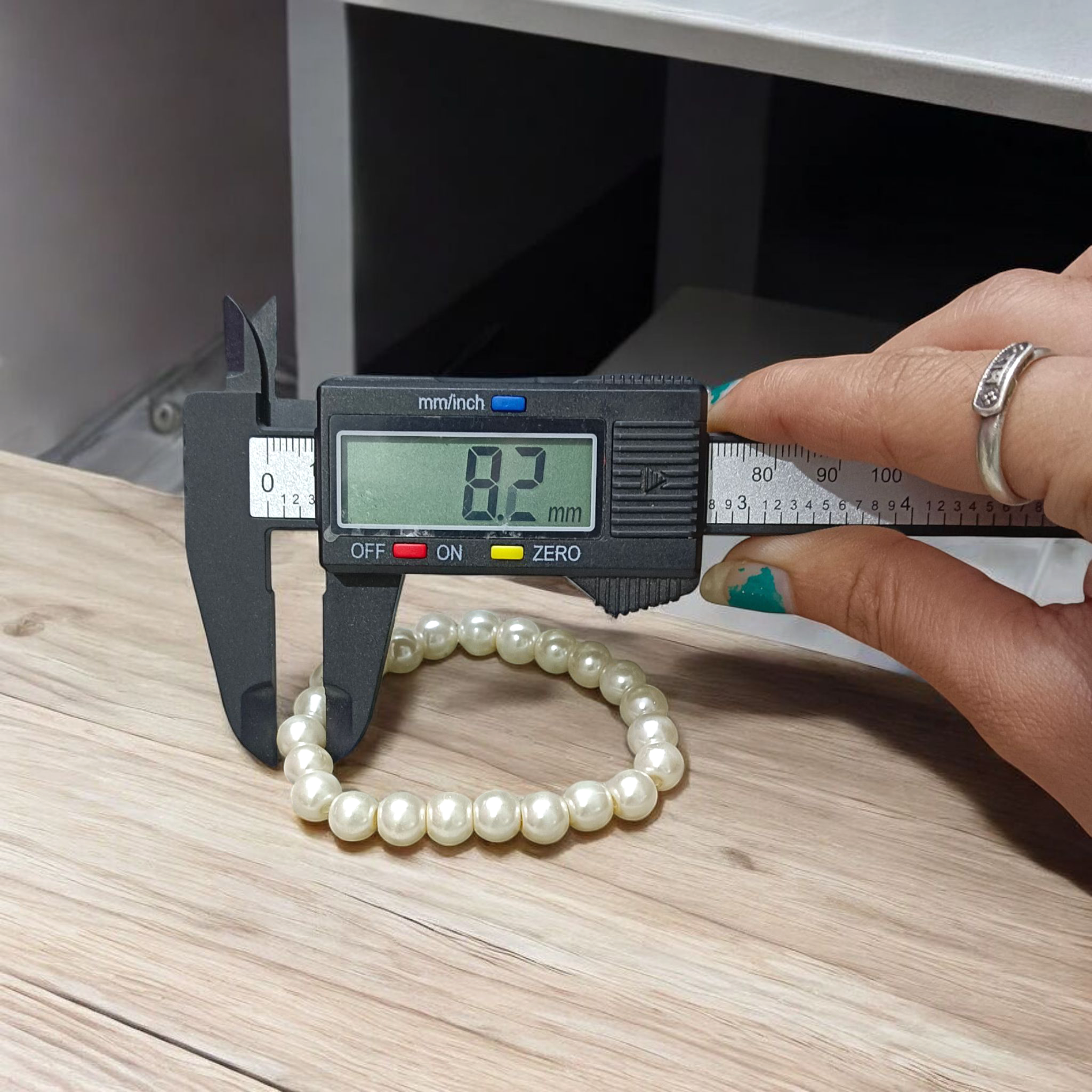 Natural Pearl Bracelet with 8mm round white pearls, stretchable design, perfect for men and women, displayed on a clean background