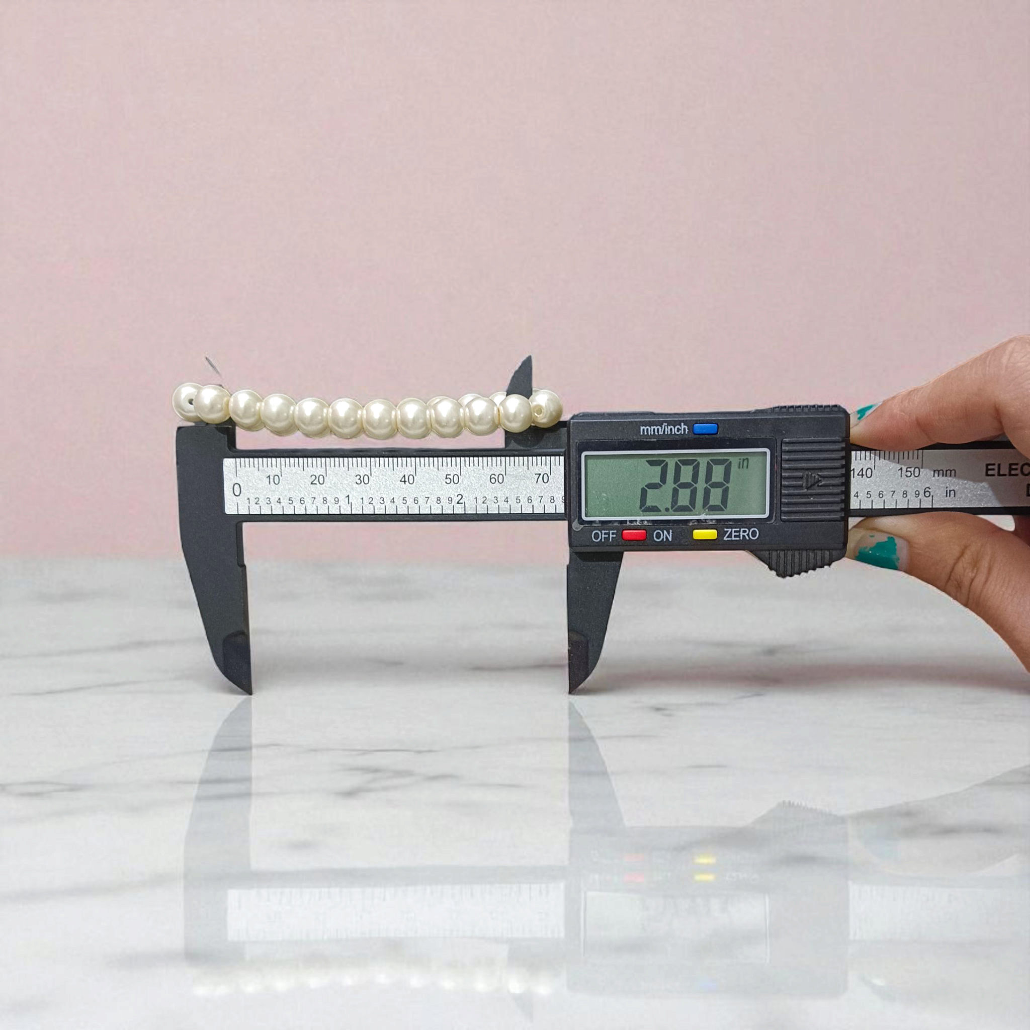 Natural Pearl Bracelet with 8mm round white pearls, stretchable design, perfect for men and women, displayed on a clean background