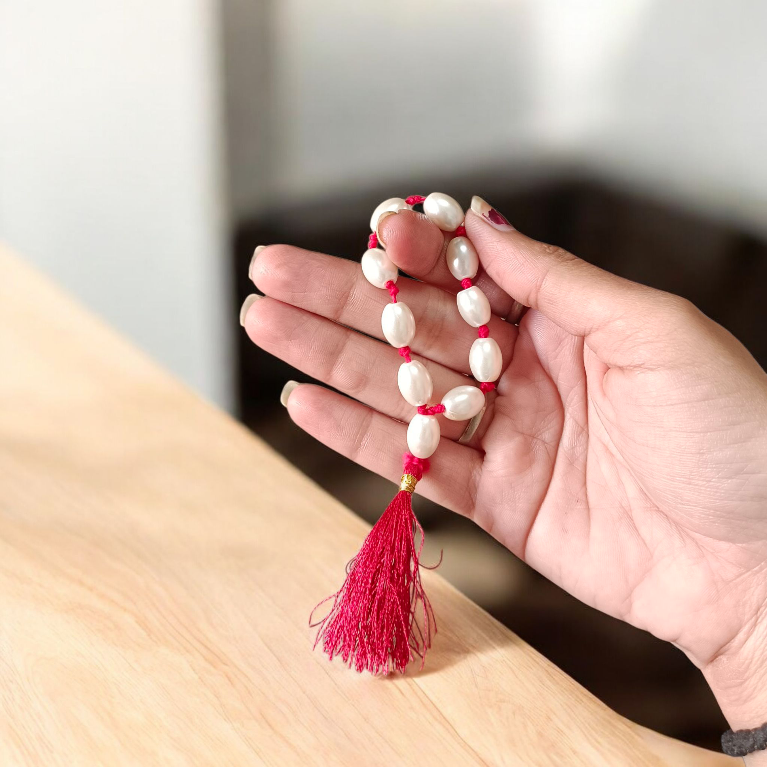 Natural Pearl Finger Mala with 9+1 round white pearls (10–11mm) displayed on a soft background, ideal for chanting and meditation