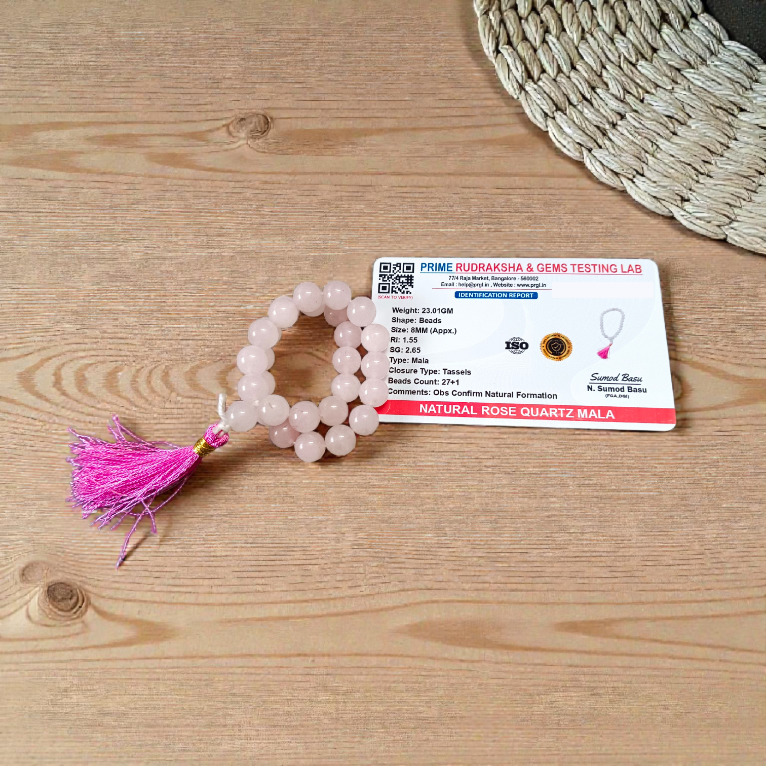 Natural Rose Quartz Mala with 8mm pink beads arranged neatly for meditation and spiritual use