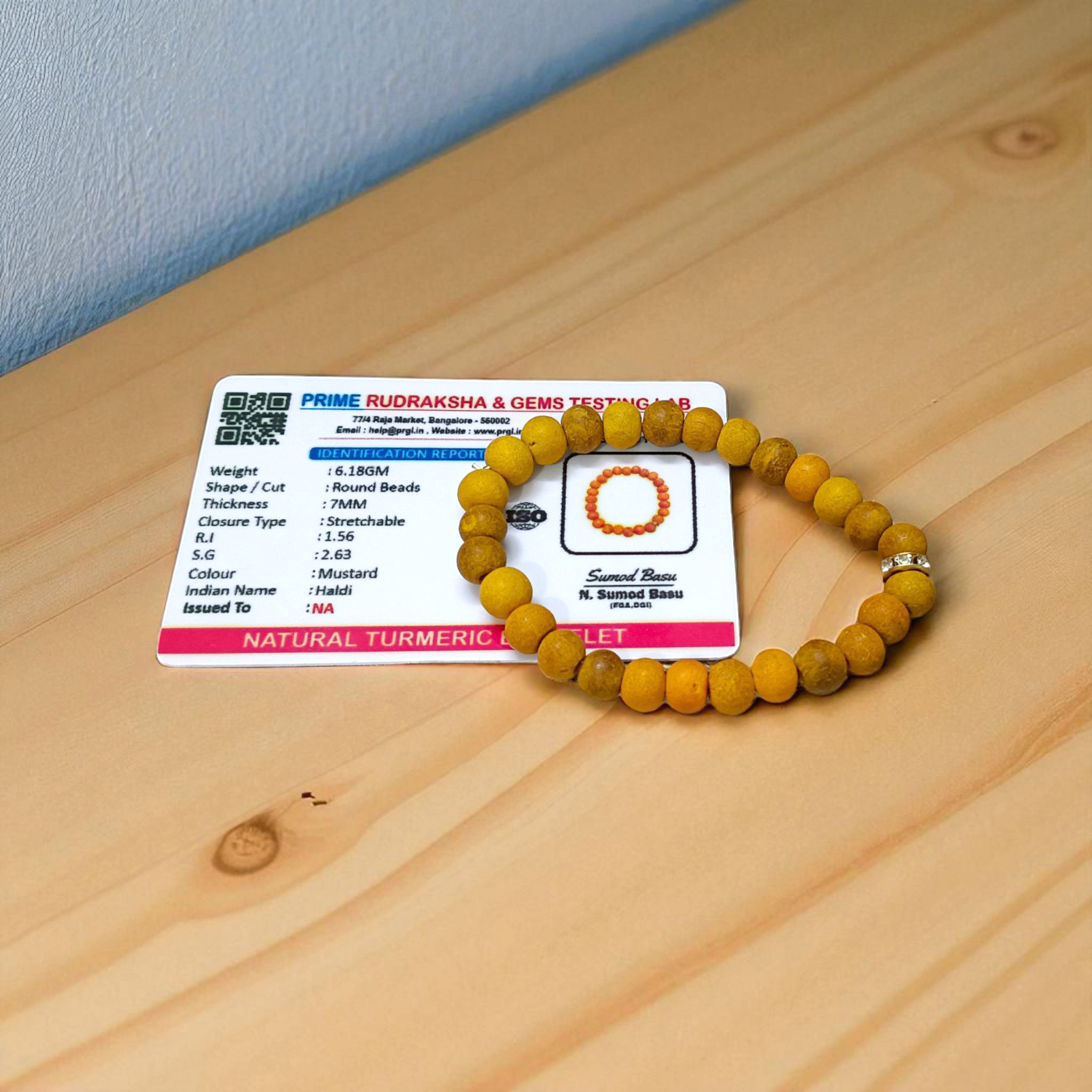 Natural Turmeric (Haldi) Bracelet with 7mm yellow beads, stretchable and handcrafted, displayed on a neutral background for men and women