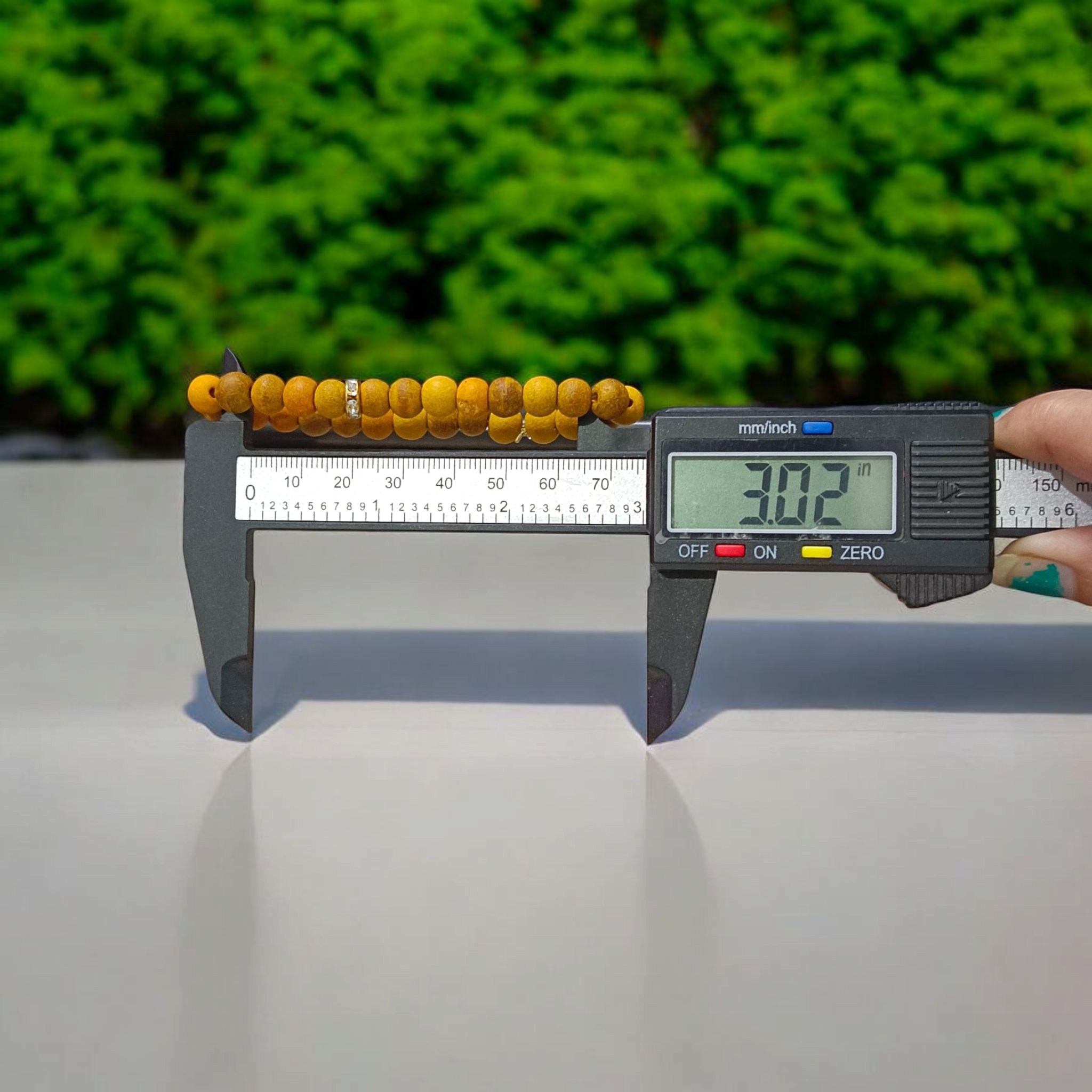 Natural Turmeric (Haldi) Bracelet with 7mm yellow beads, stretchable and handcrafted, displayed on a neutral background for men and women