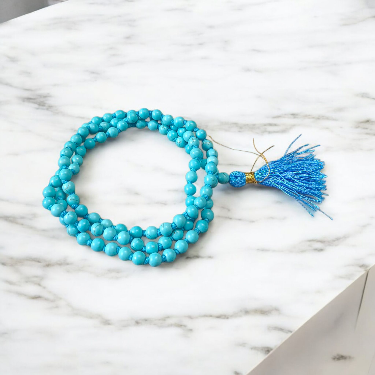 Natural Turquoise (Firoza) Mala with 108+1 round beads (6mm), used for meditation, healing, and spiritual protection