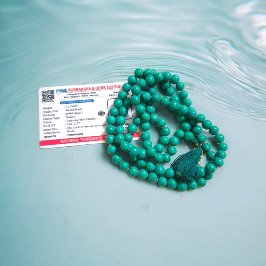 Natural Turquoise Mala with 8mm beads laid out on a wooden surface, showing two variants 27+1 and 108+1 beads.