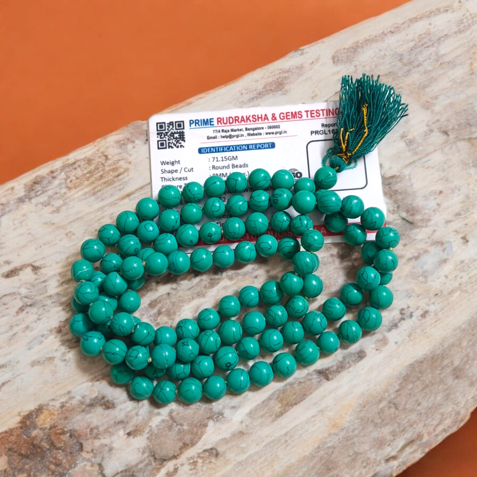 Natural Turquoise Mala with 8mm beads laid out on a wooden surface, showing two variants 27+1 and 108+1 beads.