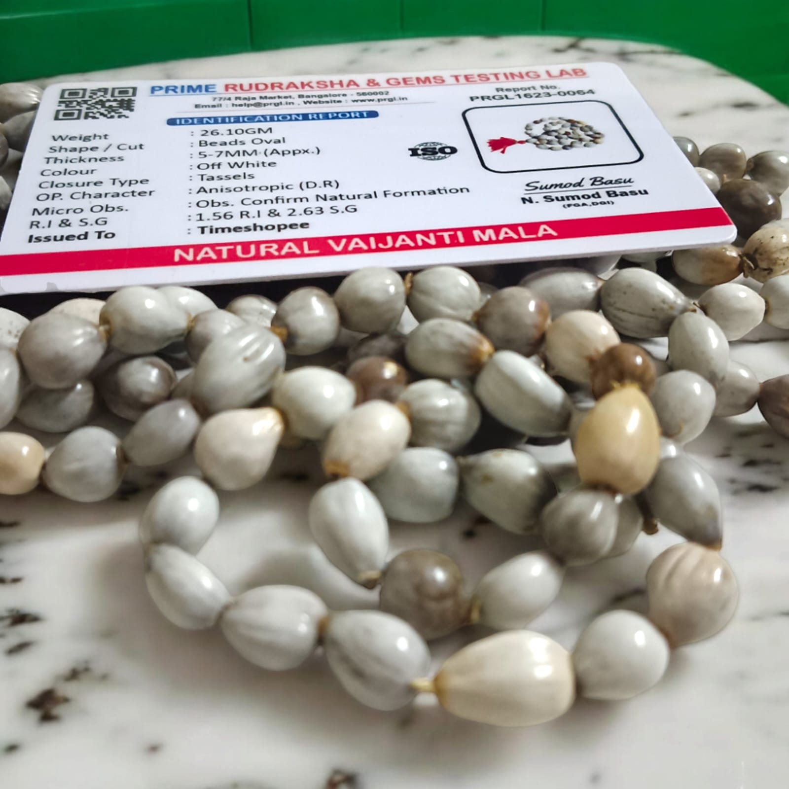 Natural Vaijanti Mala with Lab Certificate displayed in a pouch.