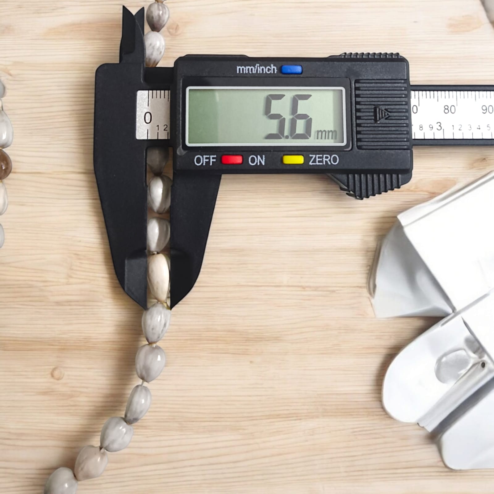 Natural Vaijanti Mala with Lab Certificate displayed in a pouch.