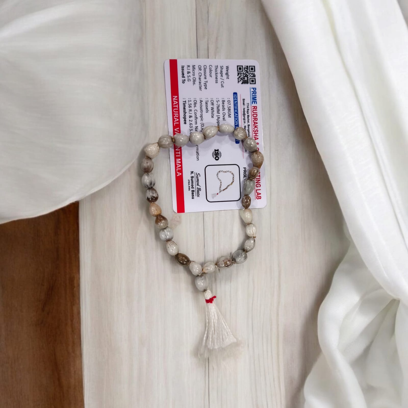 Natural Vaijanti Mala with Lab Certificate, featuring 27+1 beads, displayed in a protective pouch, ideal for jaap and meditation.