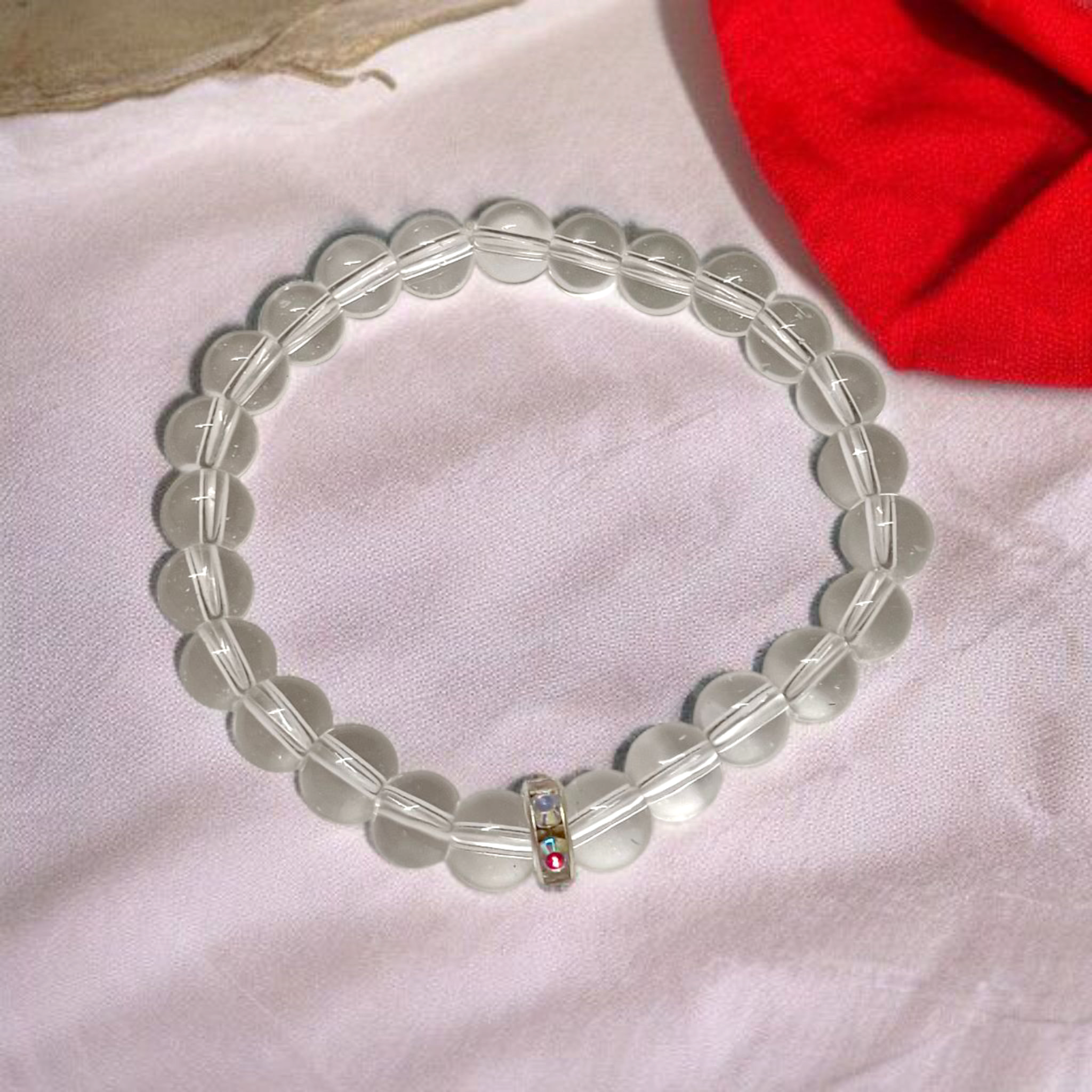 Natural crystal bracelet made of 7mm beads with stretchable string, unisex design, displayed on a neutral background