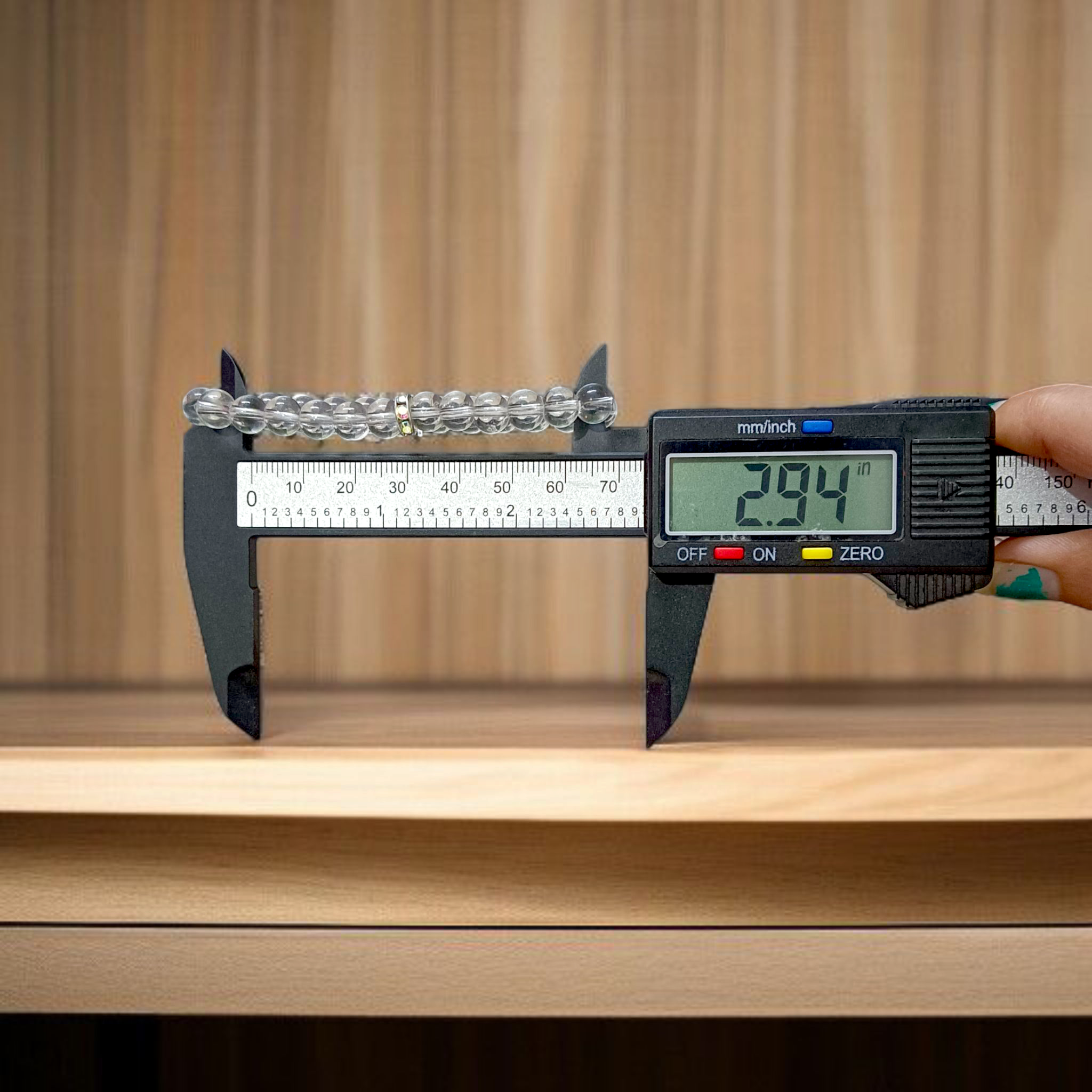 Natural crystal bracelet made of 7mm beads with stretchable string, unisex design, displayed on a neutral background