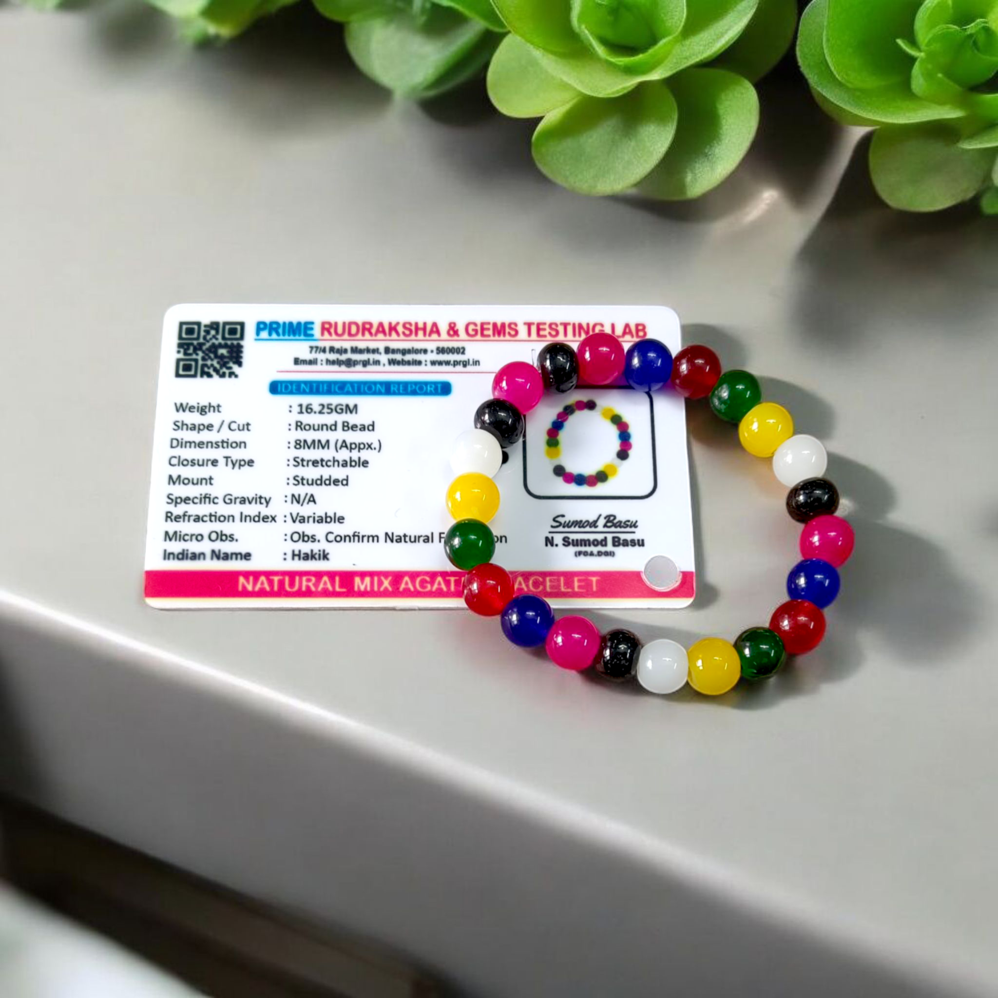 Natural multicolor agate (Hakik) bracelet made with 8mm round beads on a stretchable string, displayed on a neutral background