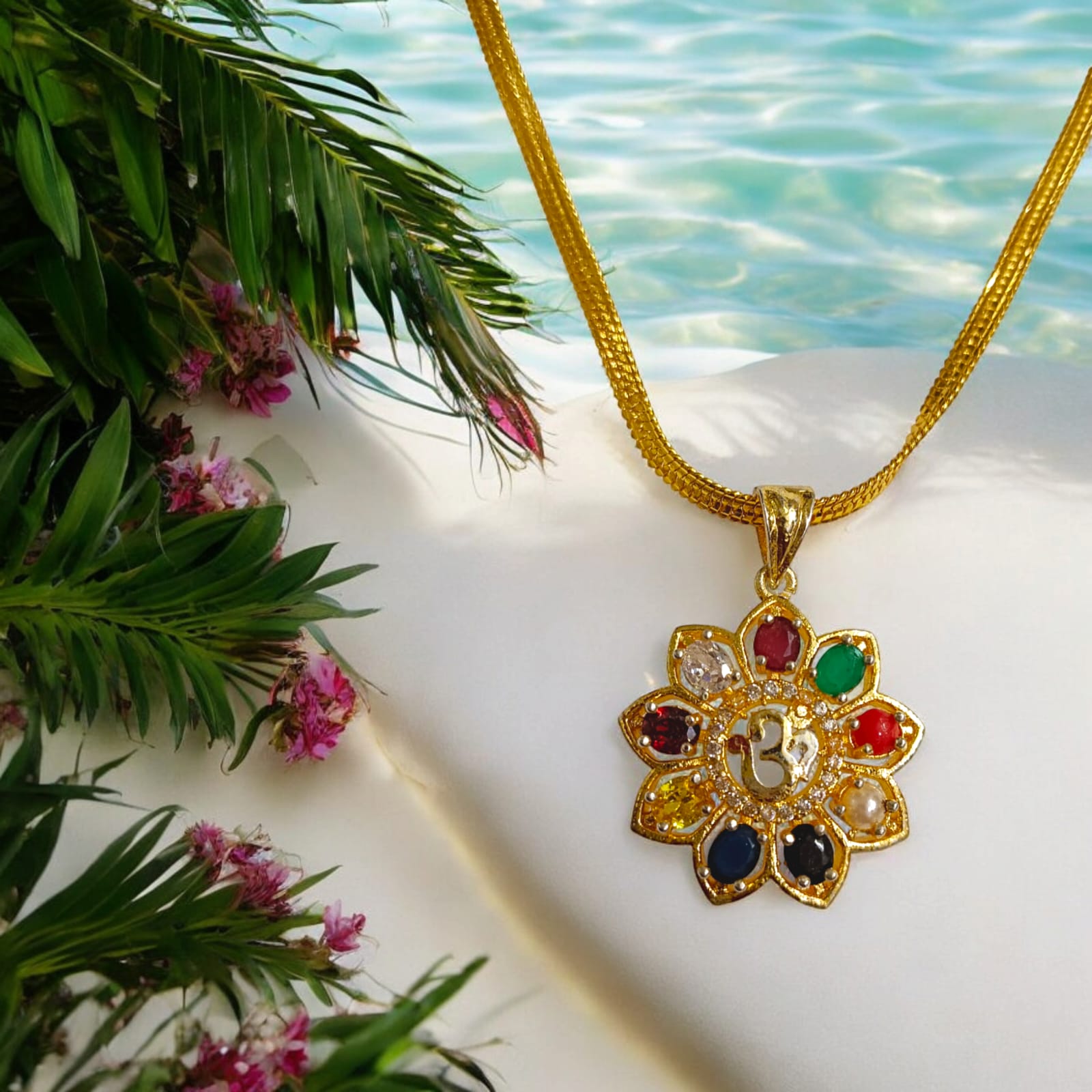 Navratan Locket with Om symbol and nine gemstones, including a free gold-plated chain for spiritual and astrological benefits.