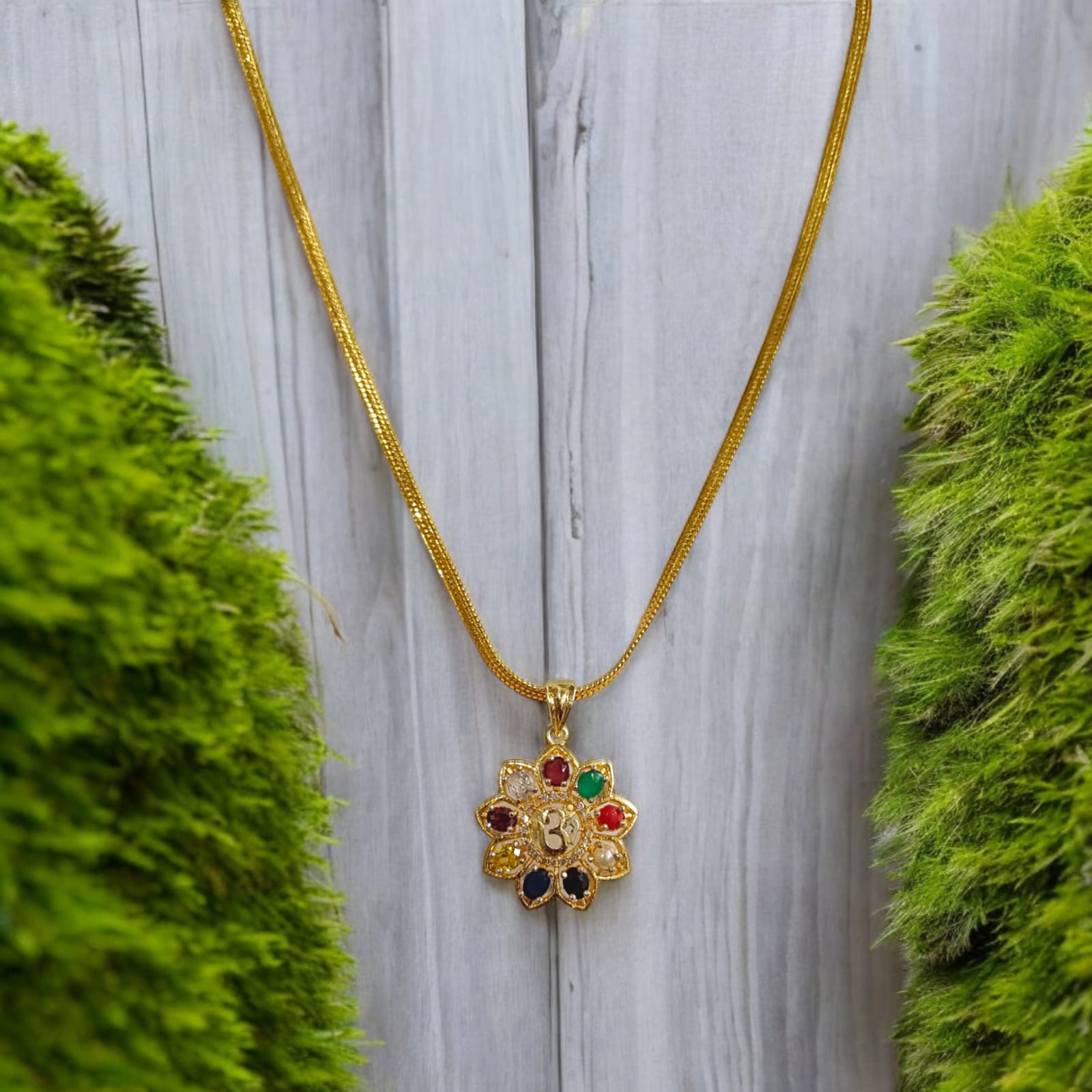 Navratan Locket with Om symbol and nine gemstones, including a free gold-plated chain for spiritual and astrological benefits.